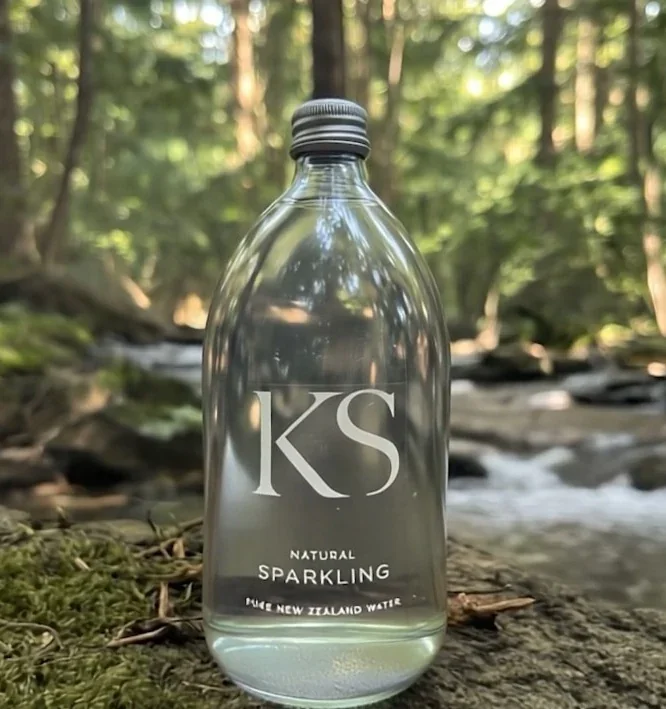 KS glass bottle with natural green landscape