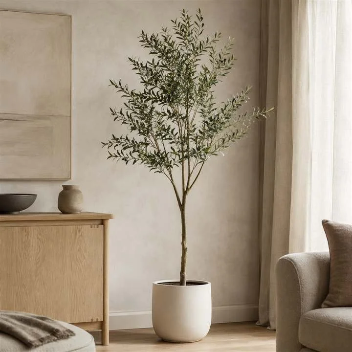 Five-foot artificial olive tree styled in a calm modern-organic interior