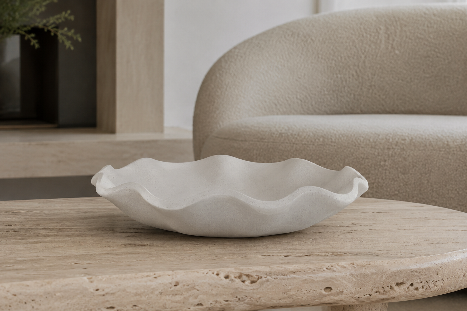 White ruffled decorative bowl styled in a calm modern-organic interior