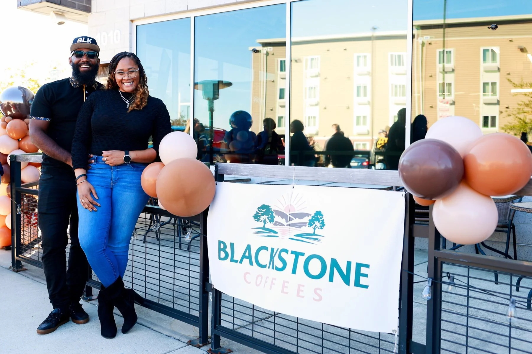 Kyle and Megan, founders of Blackstone Coffees, outside the café on opening day
