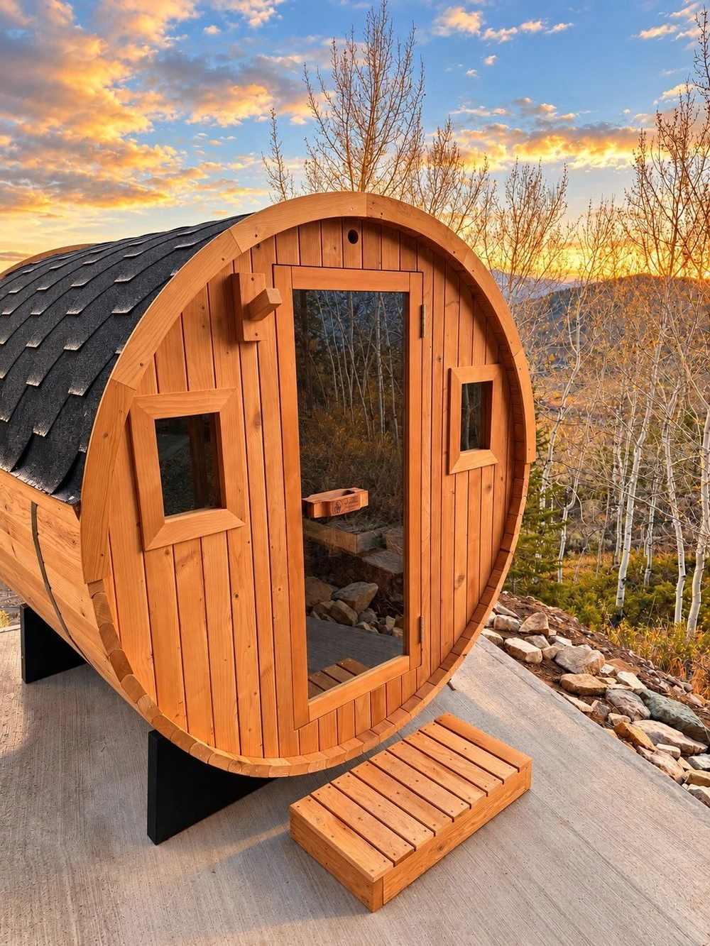 The wood barrel sauna among the aspens