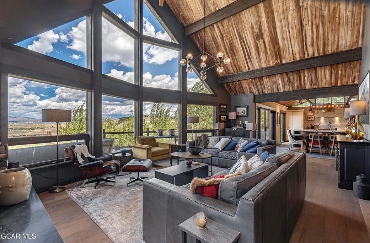 The great room with two-story windows over the valley