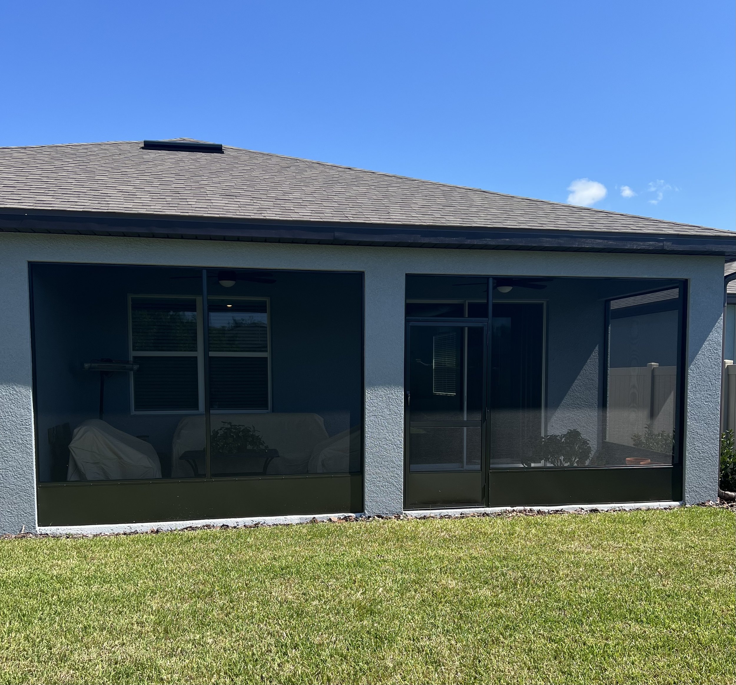 Screened lanai with outdoor seating in Brandon, FL.