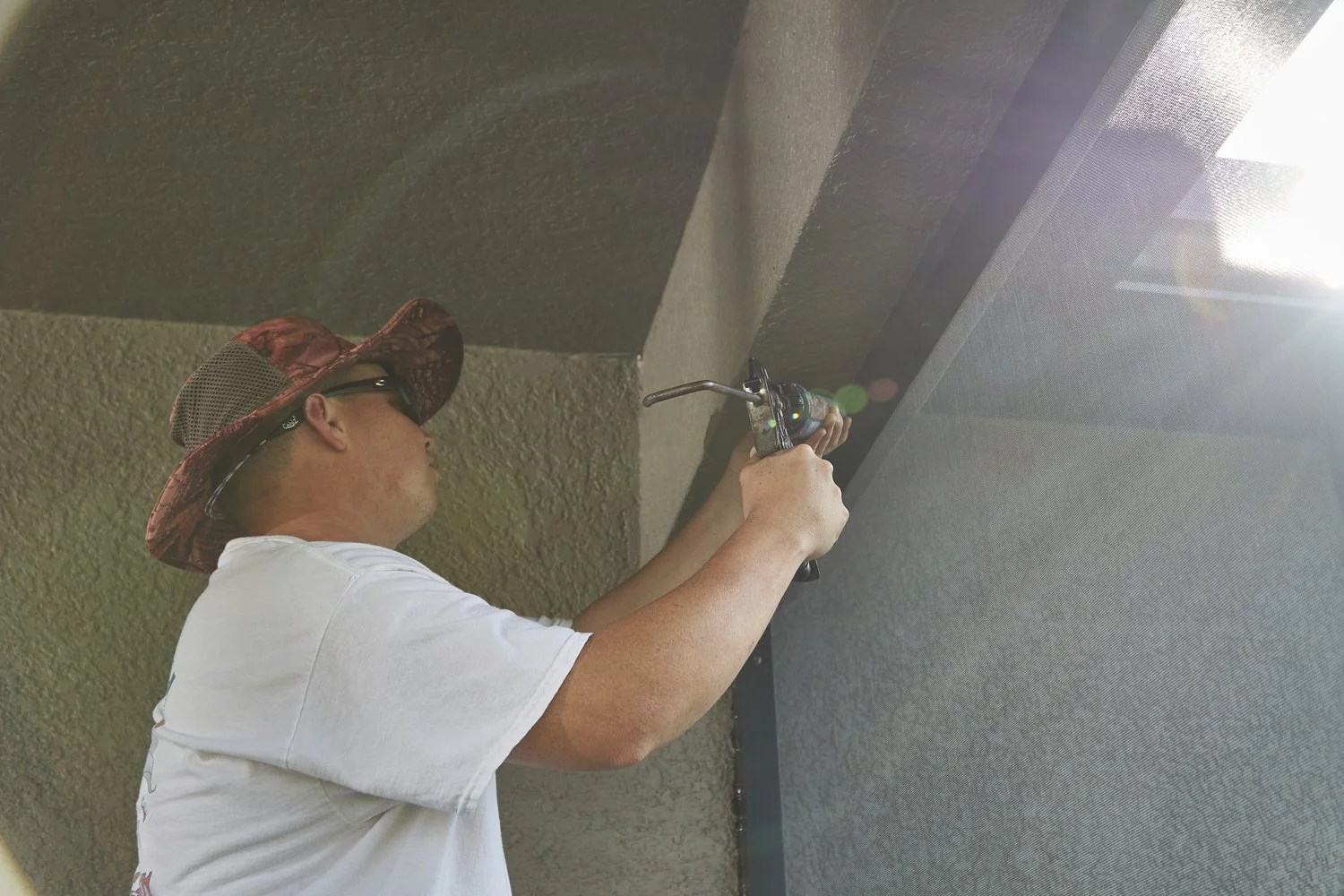 Lanai Guy crew repairing a screen enclosure.