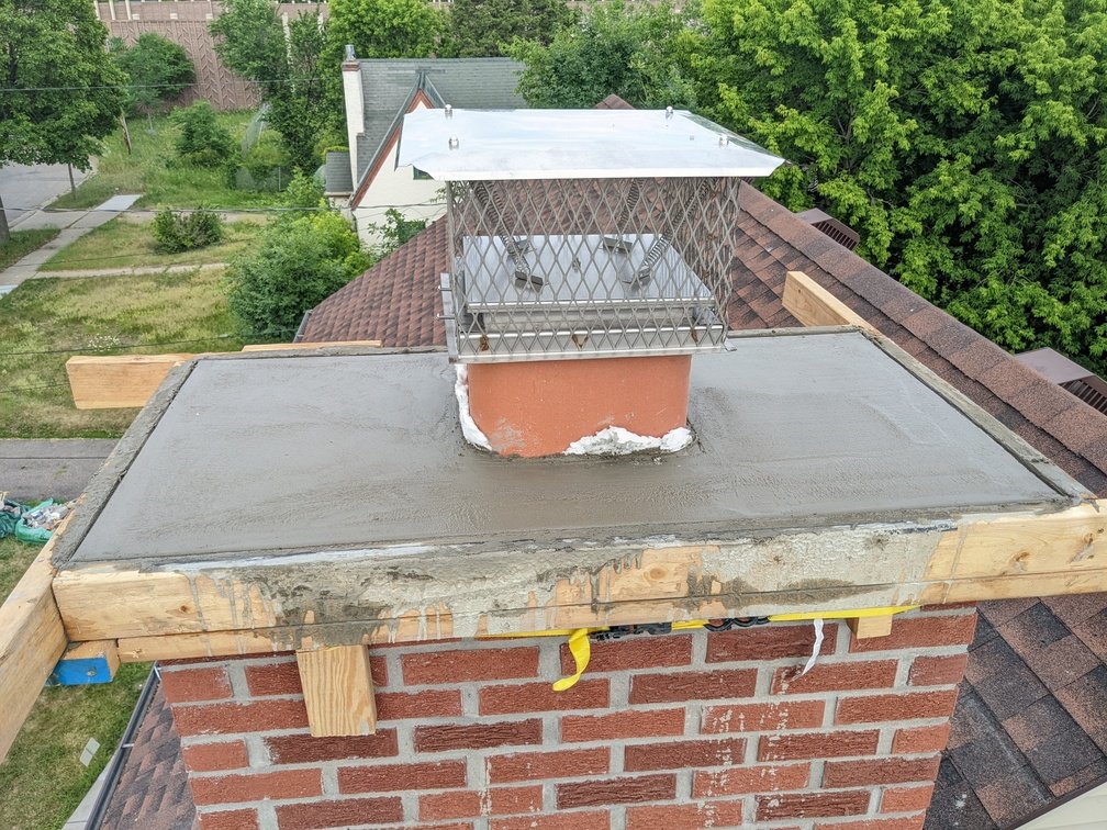 Mason repointing a brick wall in the Twin Cities