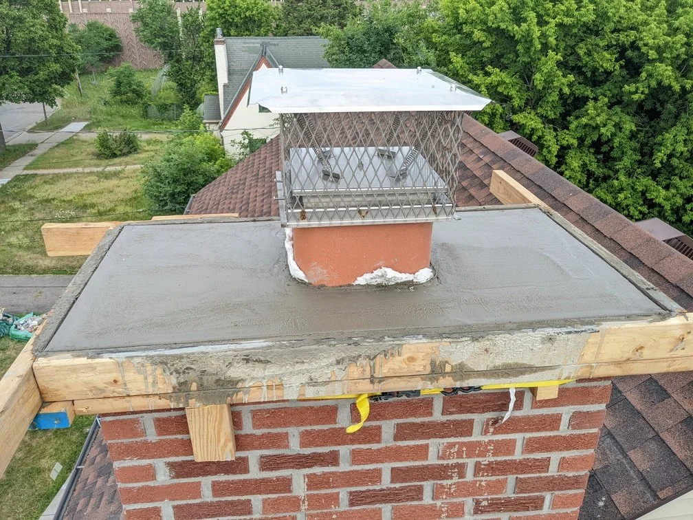 Mason repointing a brick wall in the Twin Cities
