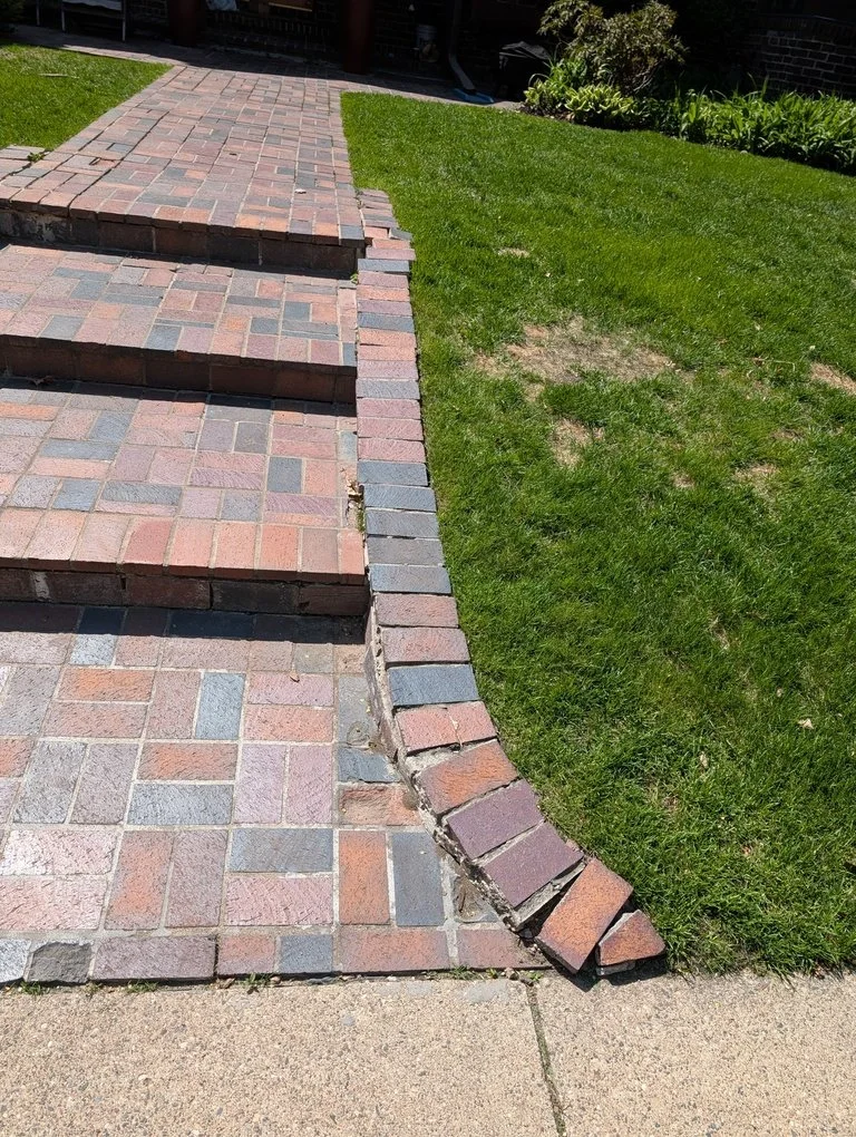 Masonry steps at the front entrance of a house