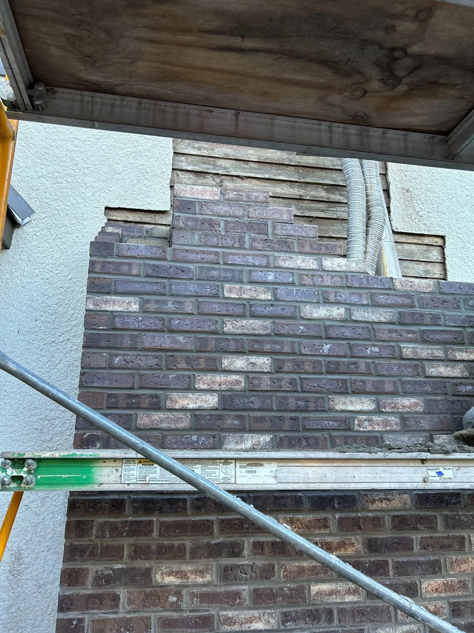 Masonry steps at the front entrance of a house