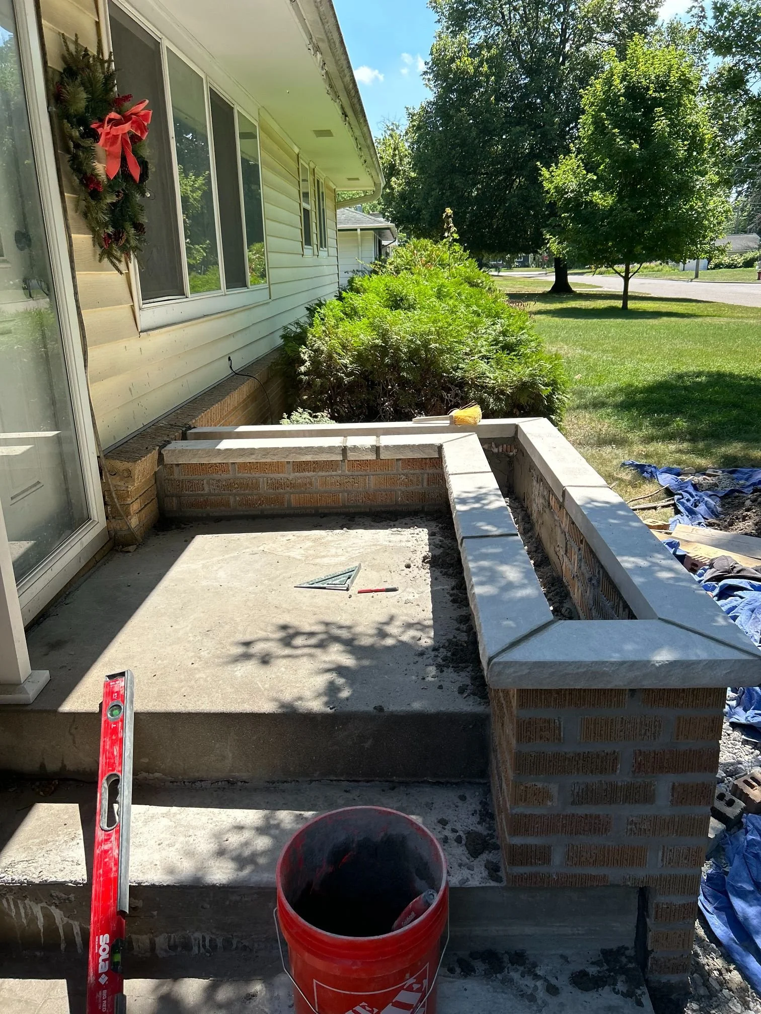 A stone side wall beside a run of front steps
