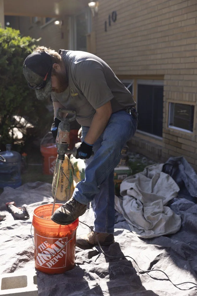 Mortar being mixed on site to the specification chosen for the wall