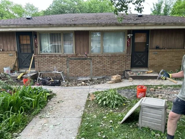 Masonry steps at the front entrance of a house