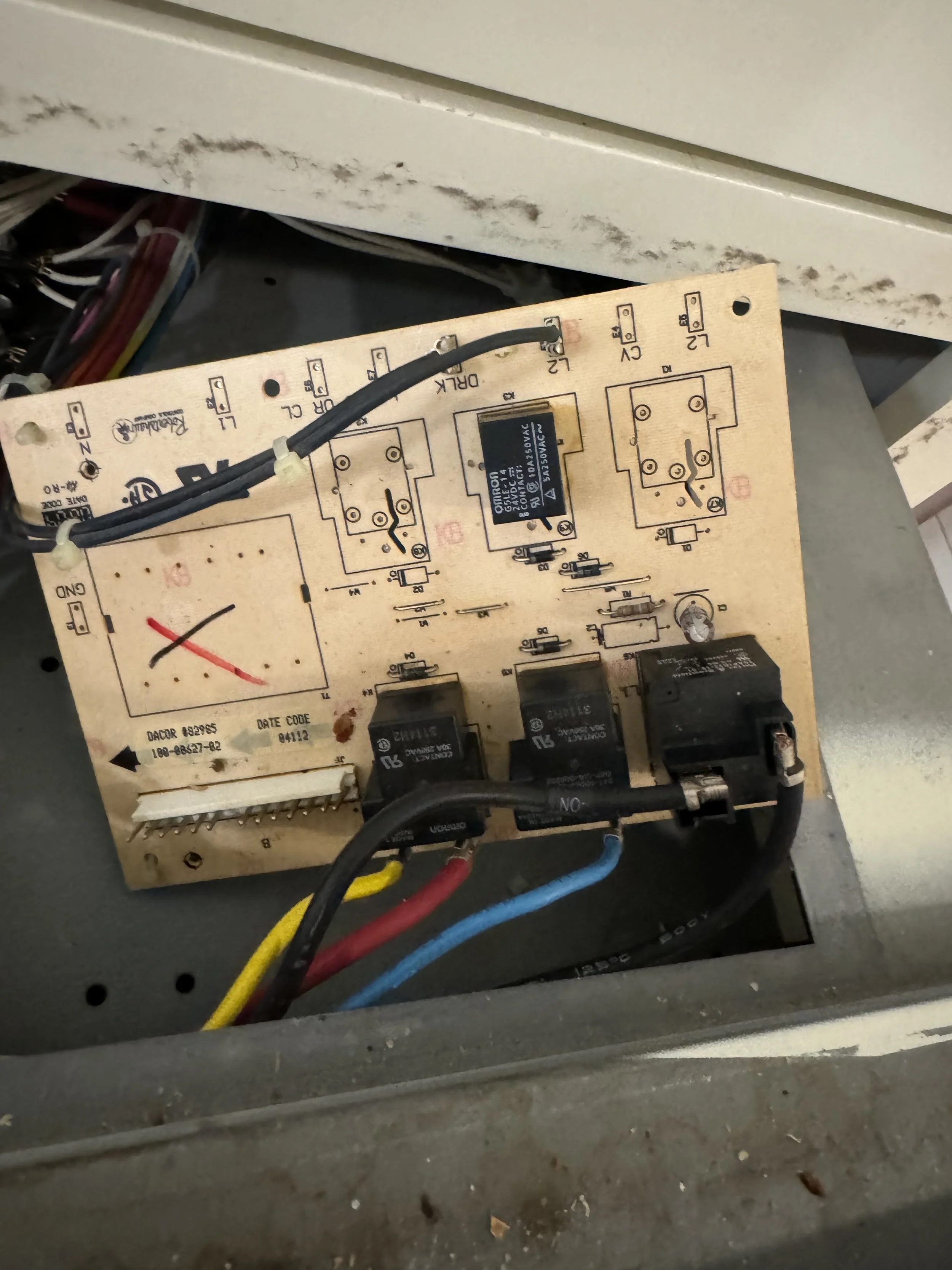Control board with relays during a Spokane refrigerator repair by SD Appliance