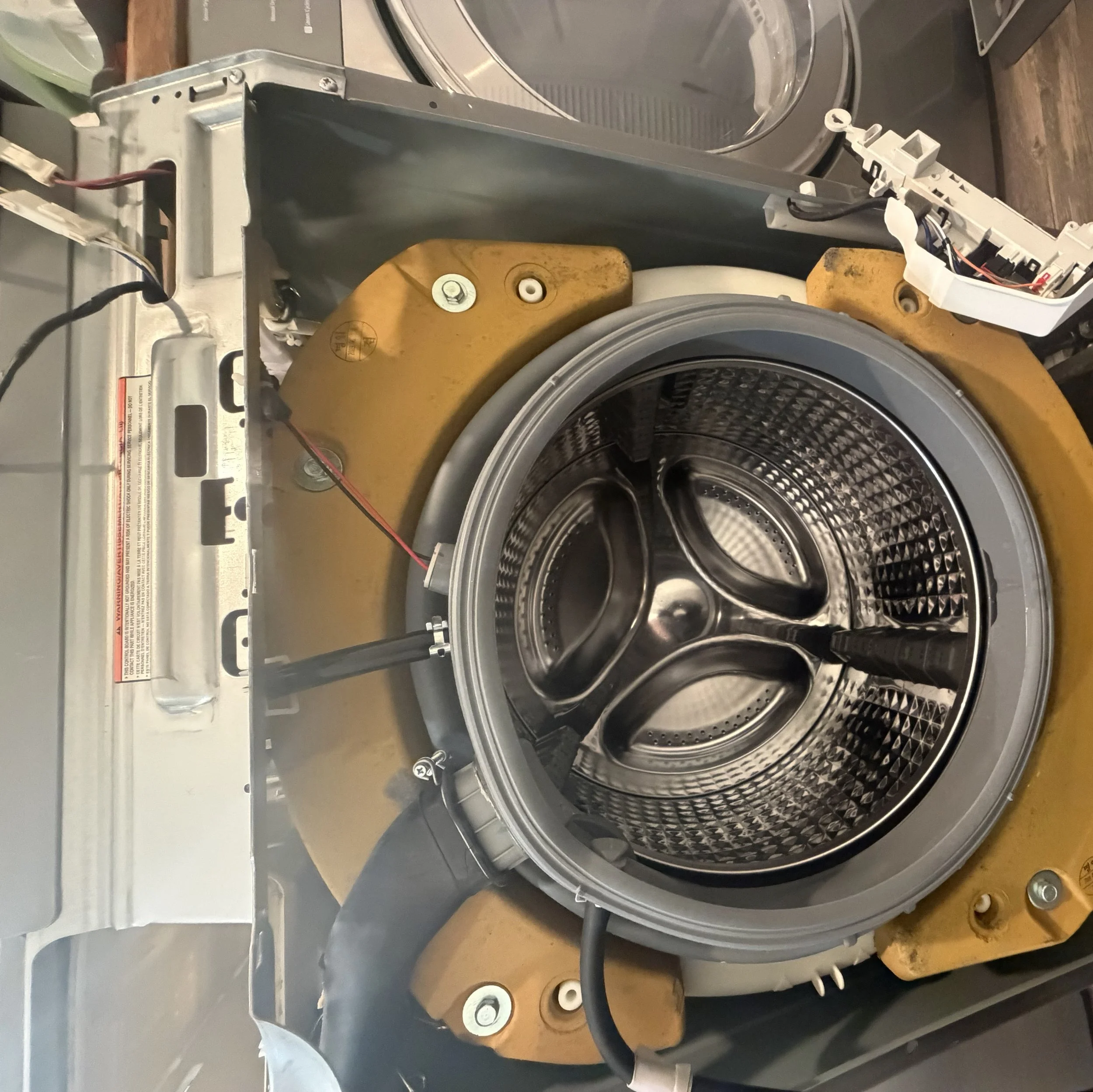 Front-load washer drum, door open during a Spokane appliance repair by SD Appliance