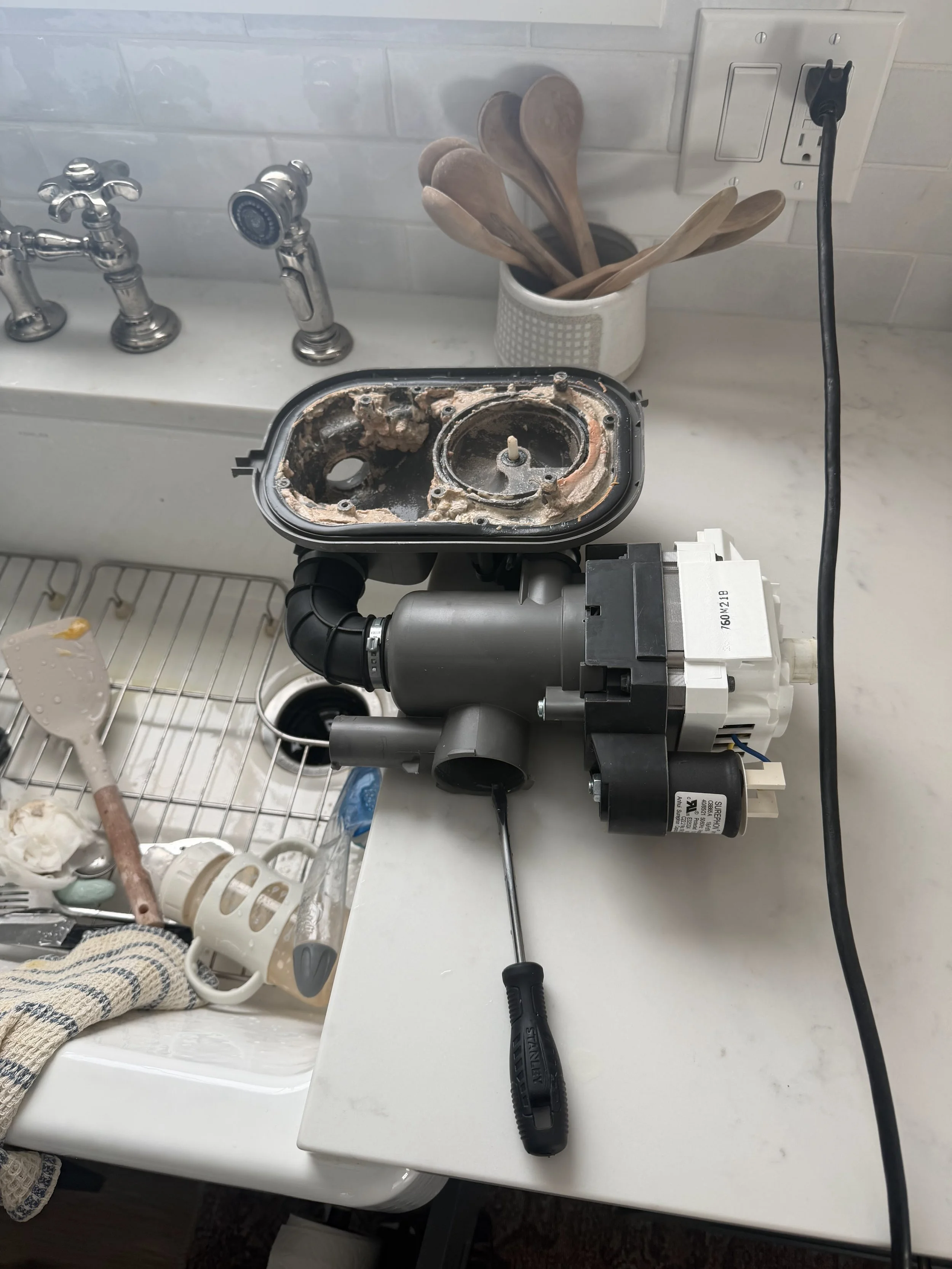 Dishwasher sump and pump assembly during a Spokane dishwasher repair by SD Appliance