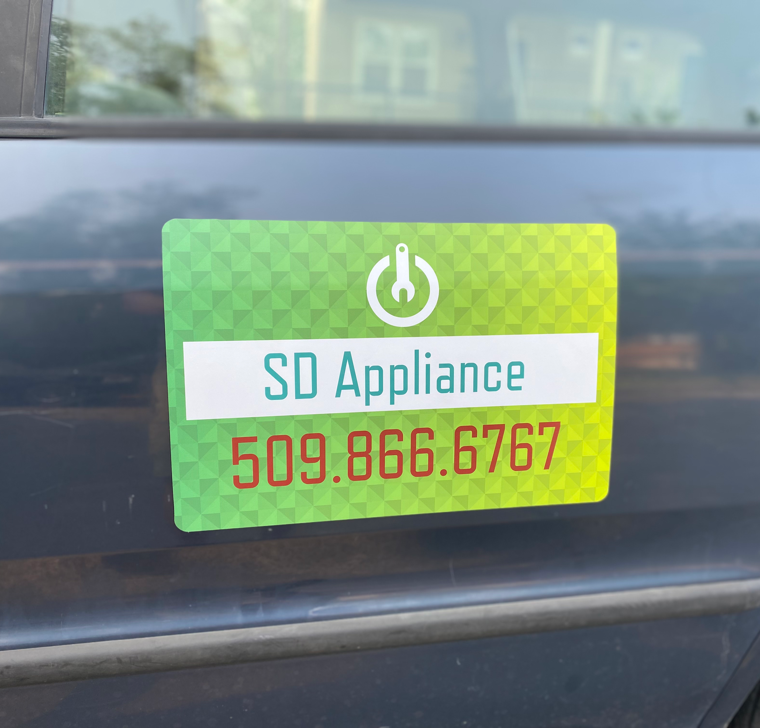 The SD Appliance vehicle decal, on the van that handles garbage disposal swaps in Coeur d'Alene