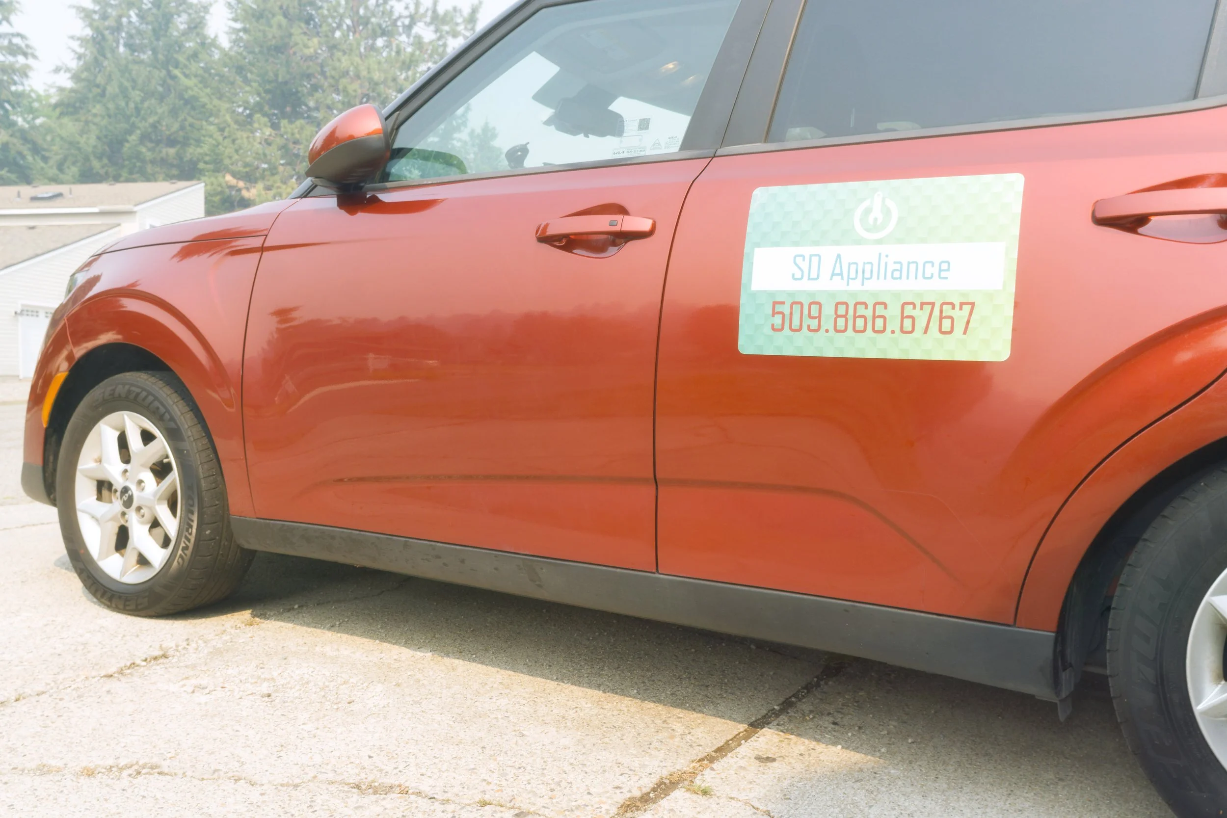 The SD Appliance decal along the side of the van