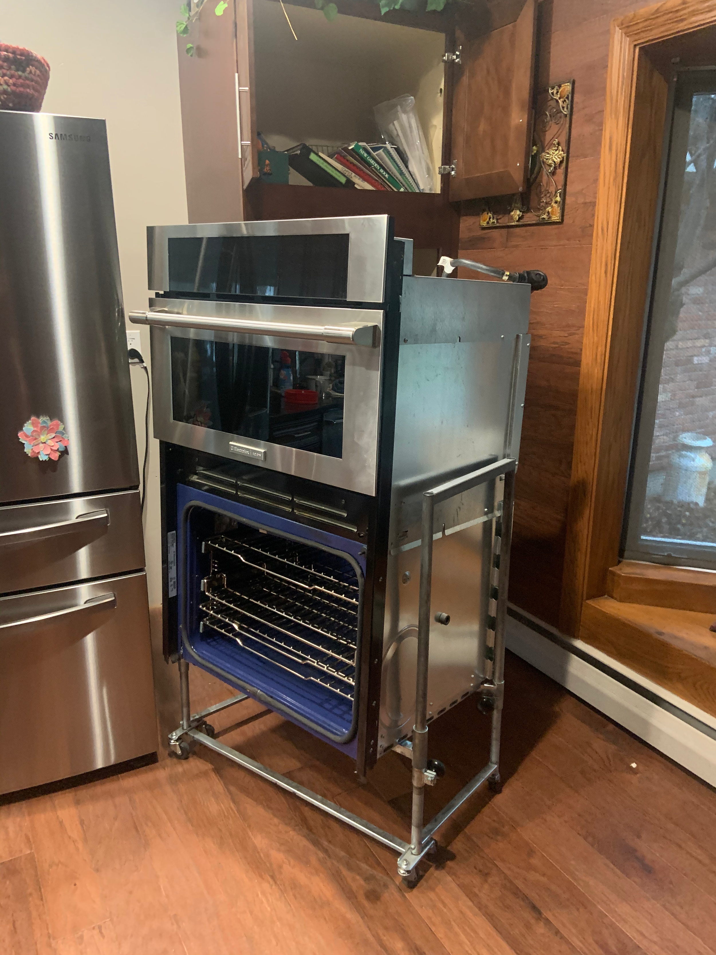 Built-in stainless double wall oven in a kitchen, the kind of oven that goes cold in a Coeur d'Alene home after a move