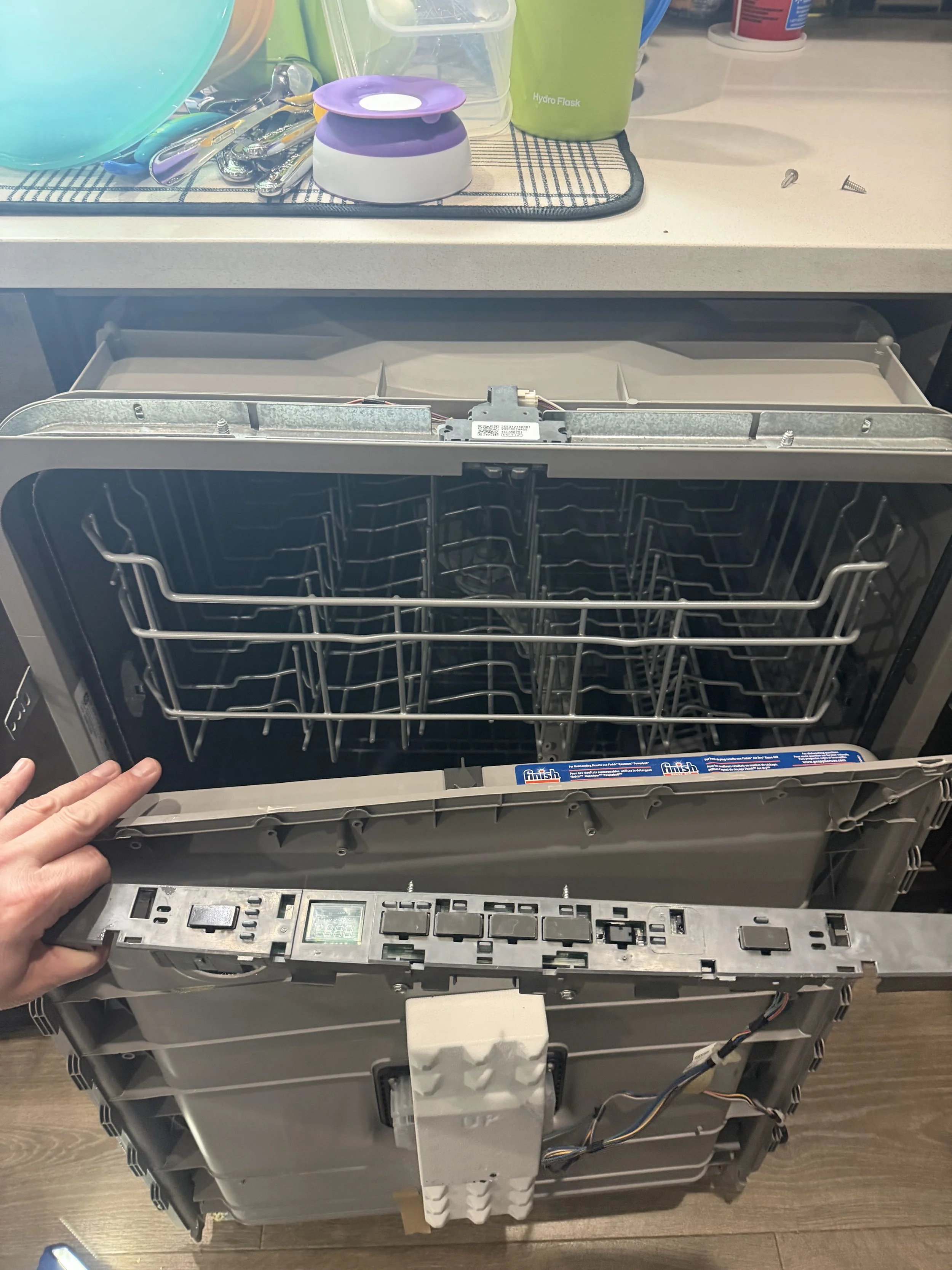 Dishwasher upper rack being adjusted
