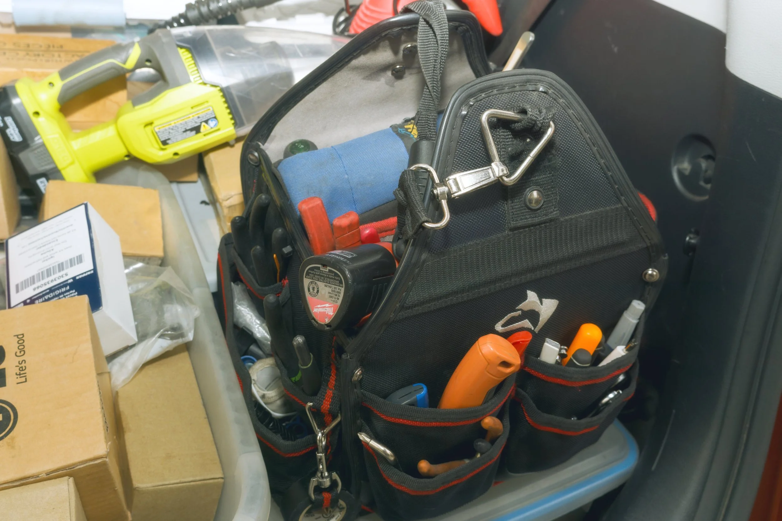 Parts and a tool bag in the back of the van