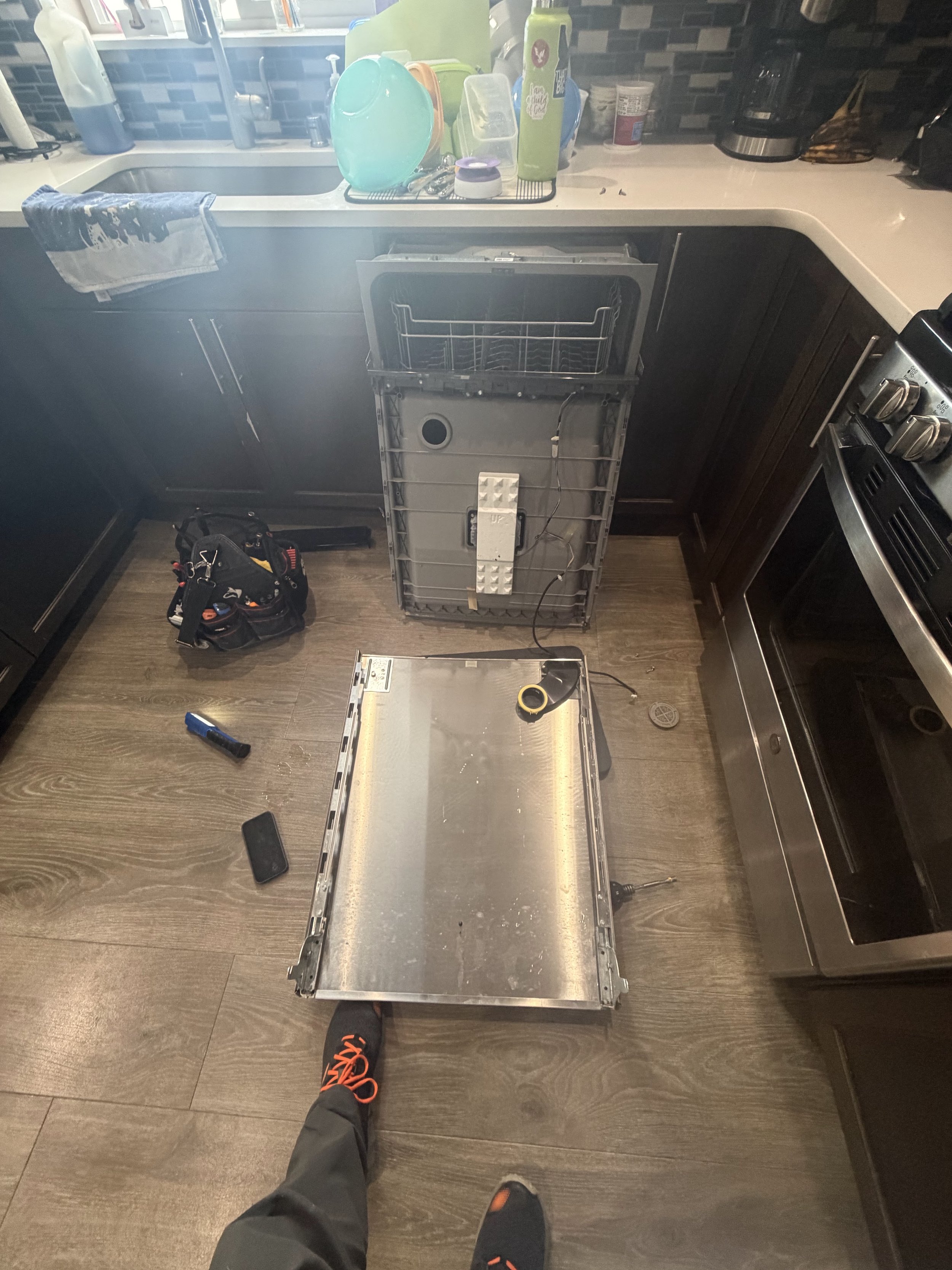 Oven door and range panel taken apart for oven repair in a Coeur d'Alene home by SD Appliance