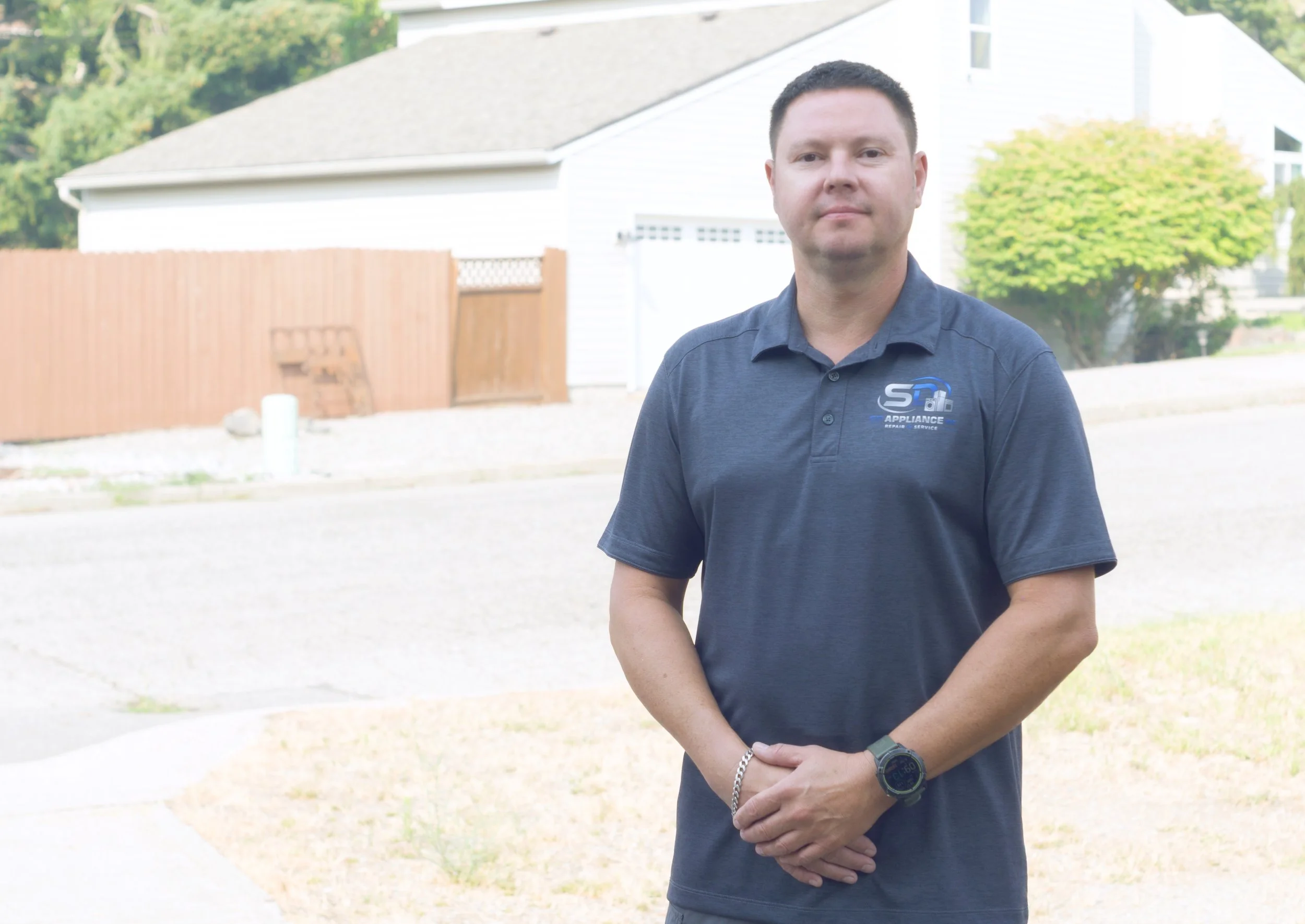 Sergei of SD Appliance in an SD polo, the owner who prices range repairs in Post Falls