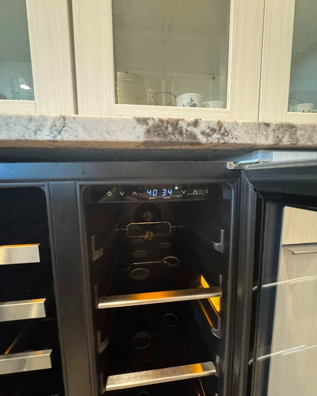 Under-counter wine cooler, door open during a Spokane wine cooler repair by SD Appliance
