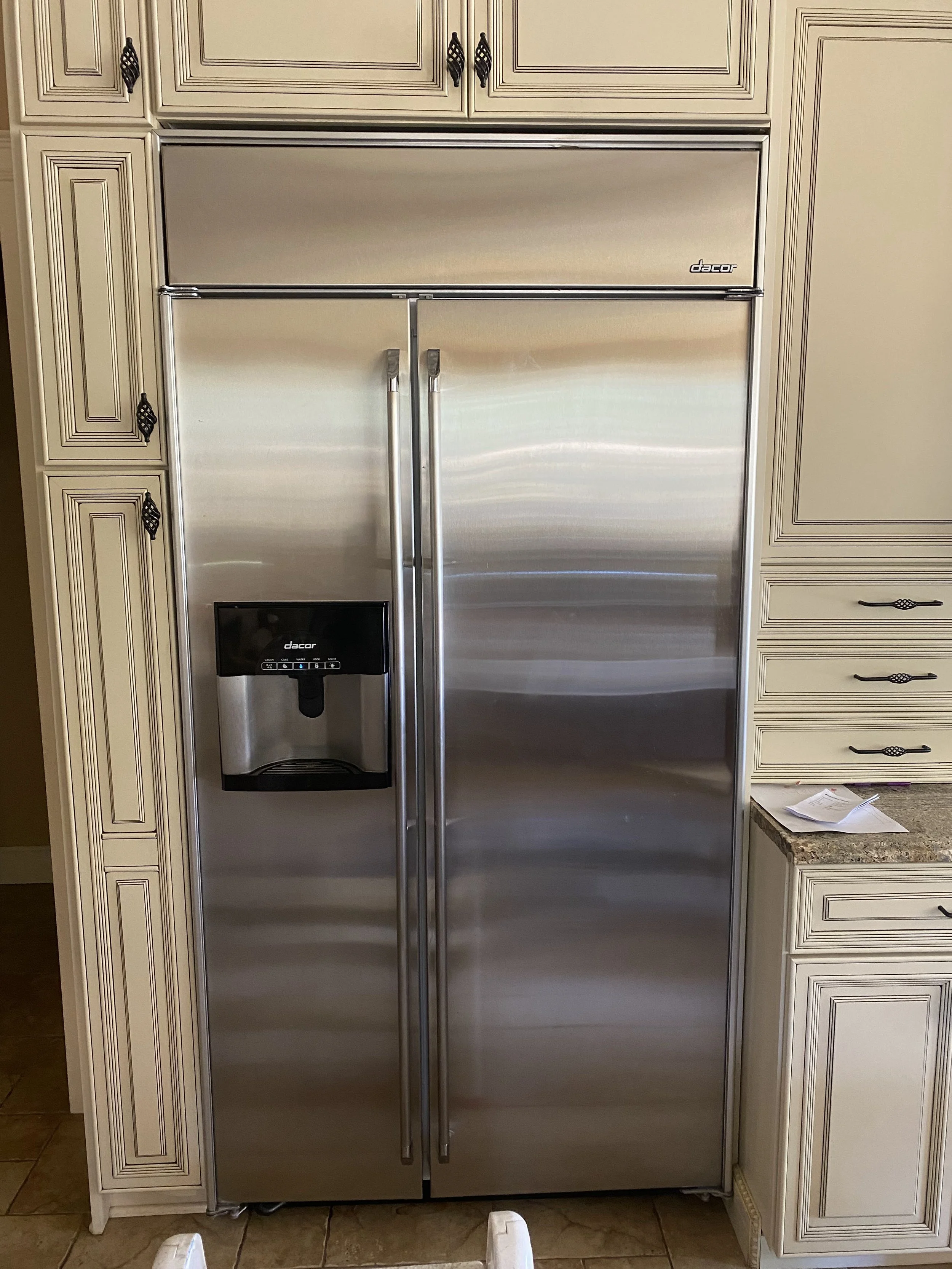 Stainless side-by-side refrigerator with a door dispenser