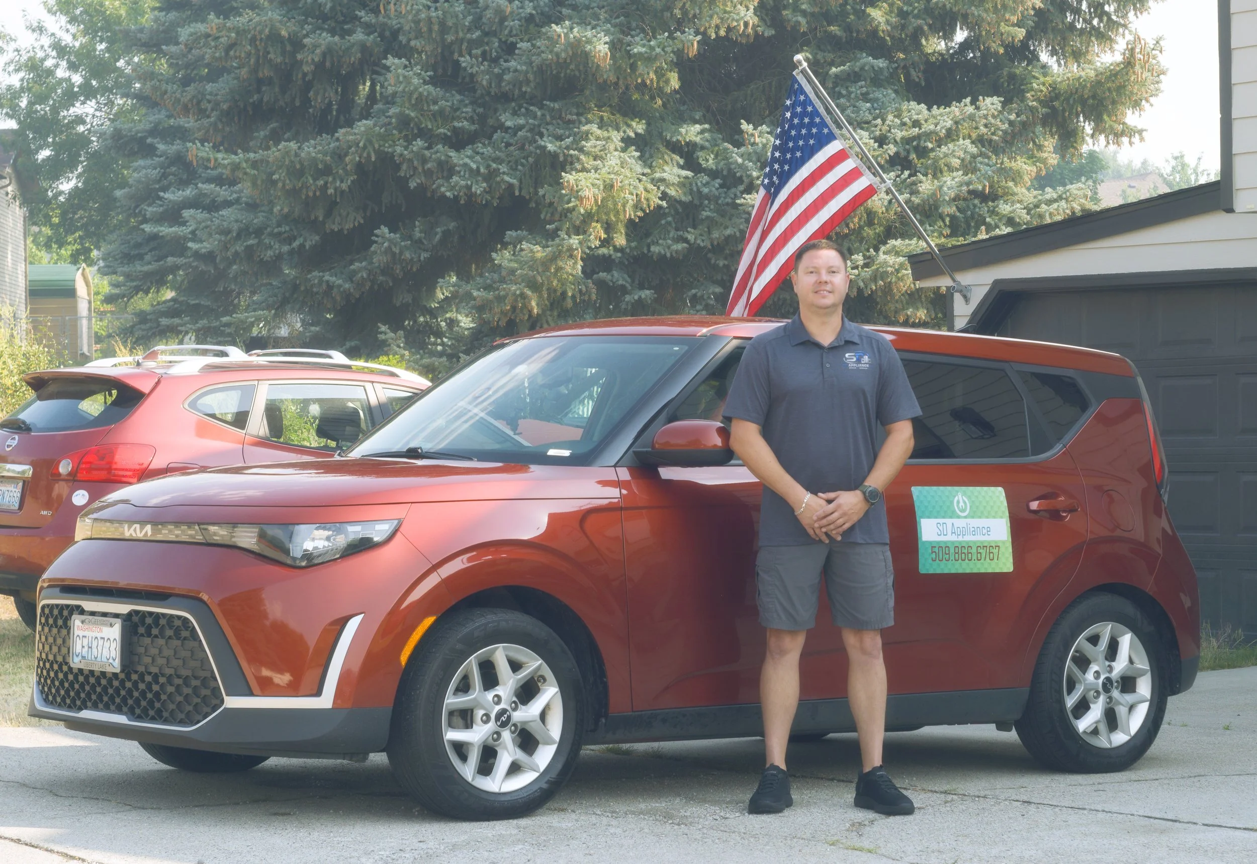 Sergei Dergunov by the van on a Liberty Lake call