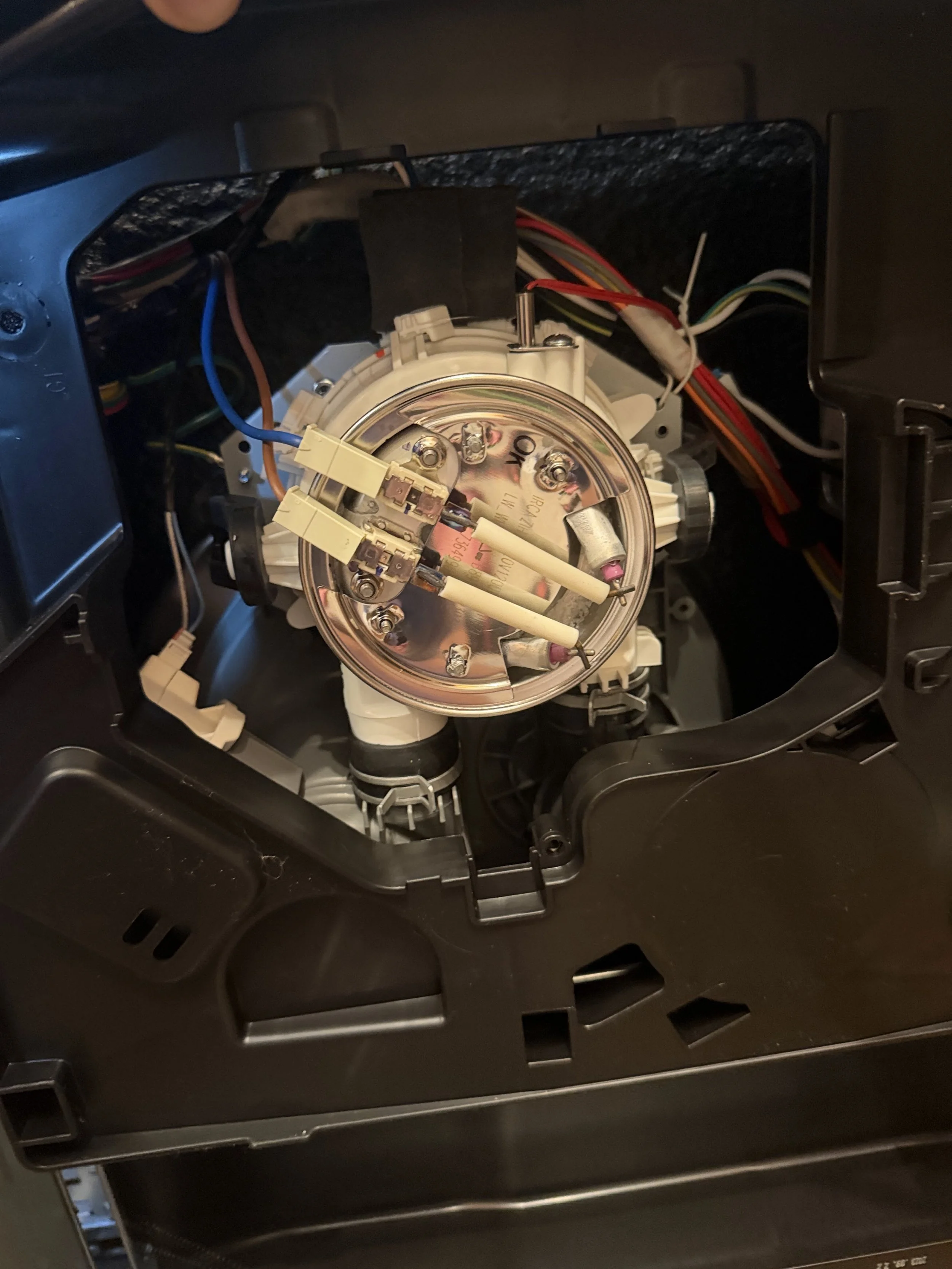 Washer motor and pump assembly, part of the in-home washer repair work done in Post Falls