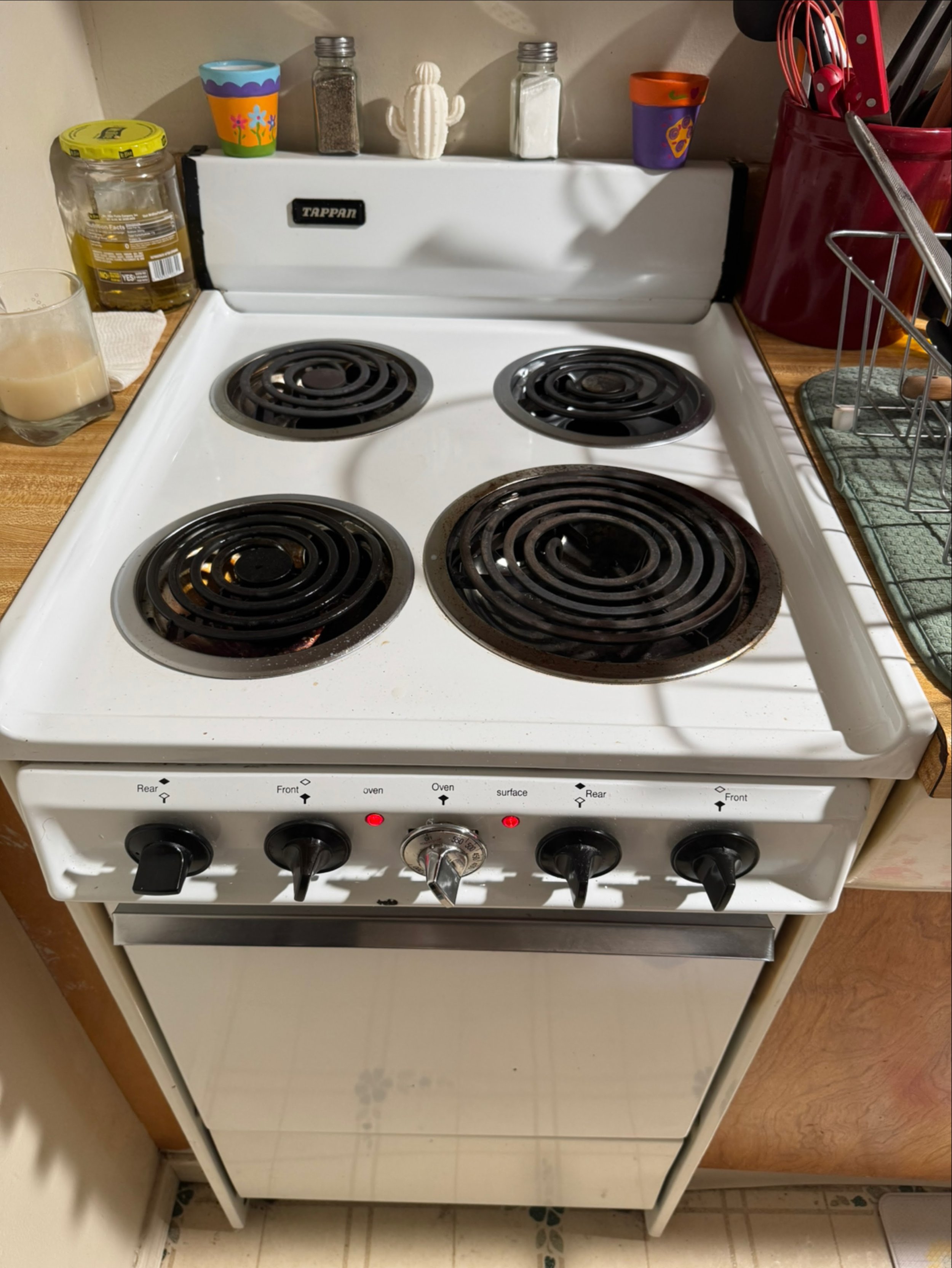 White coil electric cooktop during a Spokane range hood repair by SD Appliance