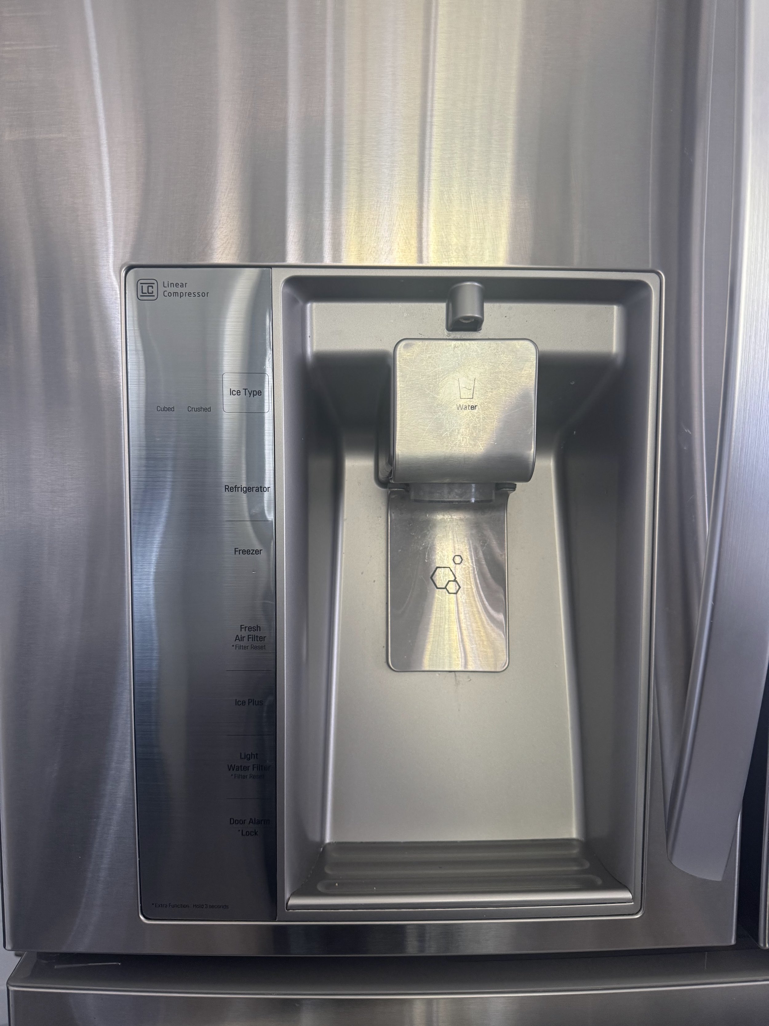 Refrigerator interior at the water dispenser area, part of the supply an ice maker shares in a Coeur d'Alene kitchen