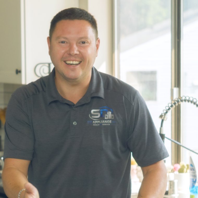 Sergei Dergunov, owner of SD Appliance, in a Spokane customer's kitchen