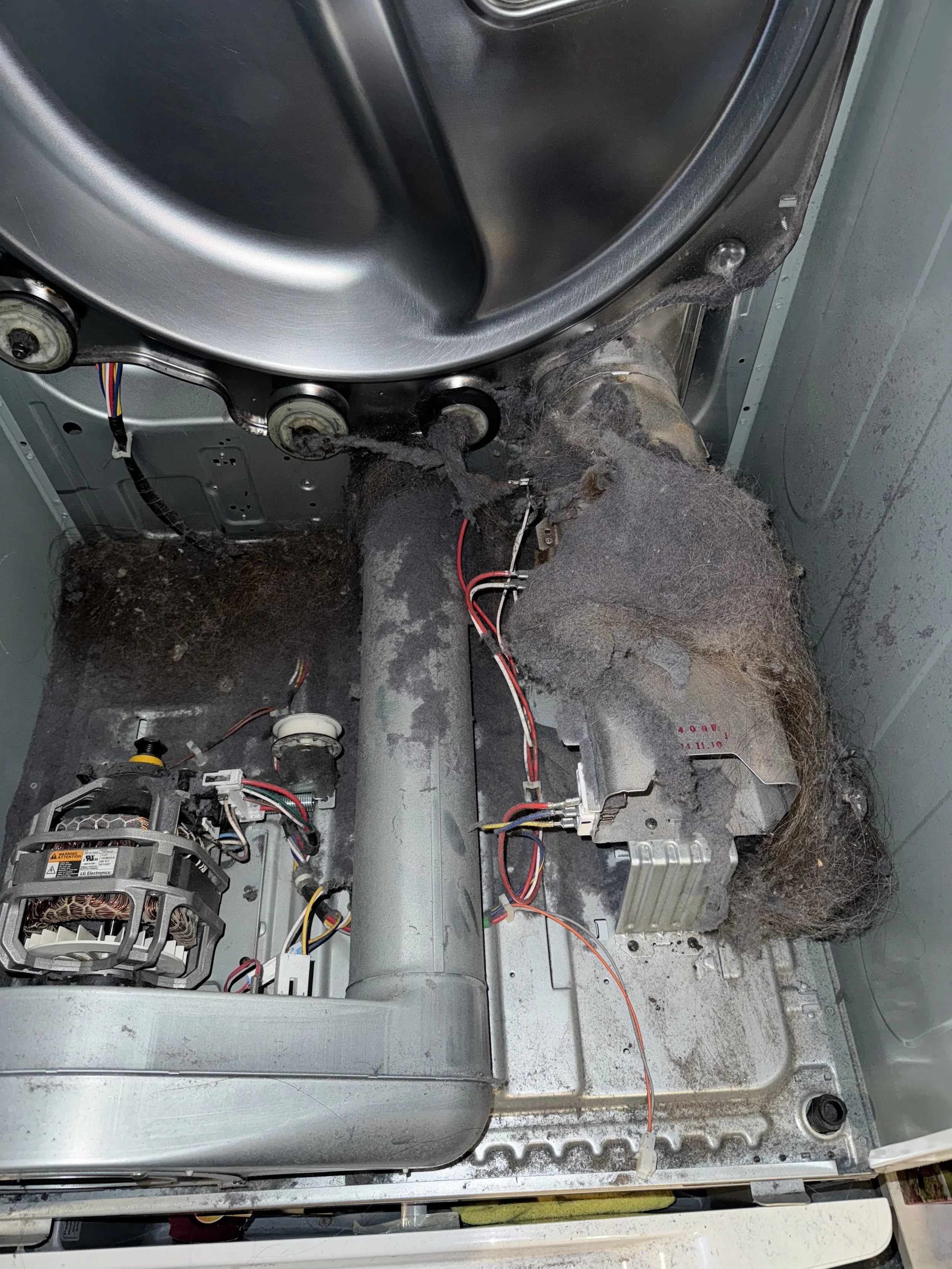 Burnt wiring in a dryer duct, the kind of exhaust run a dryer repair in a Coeur d'Alene apartment or condo building traces