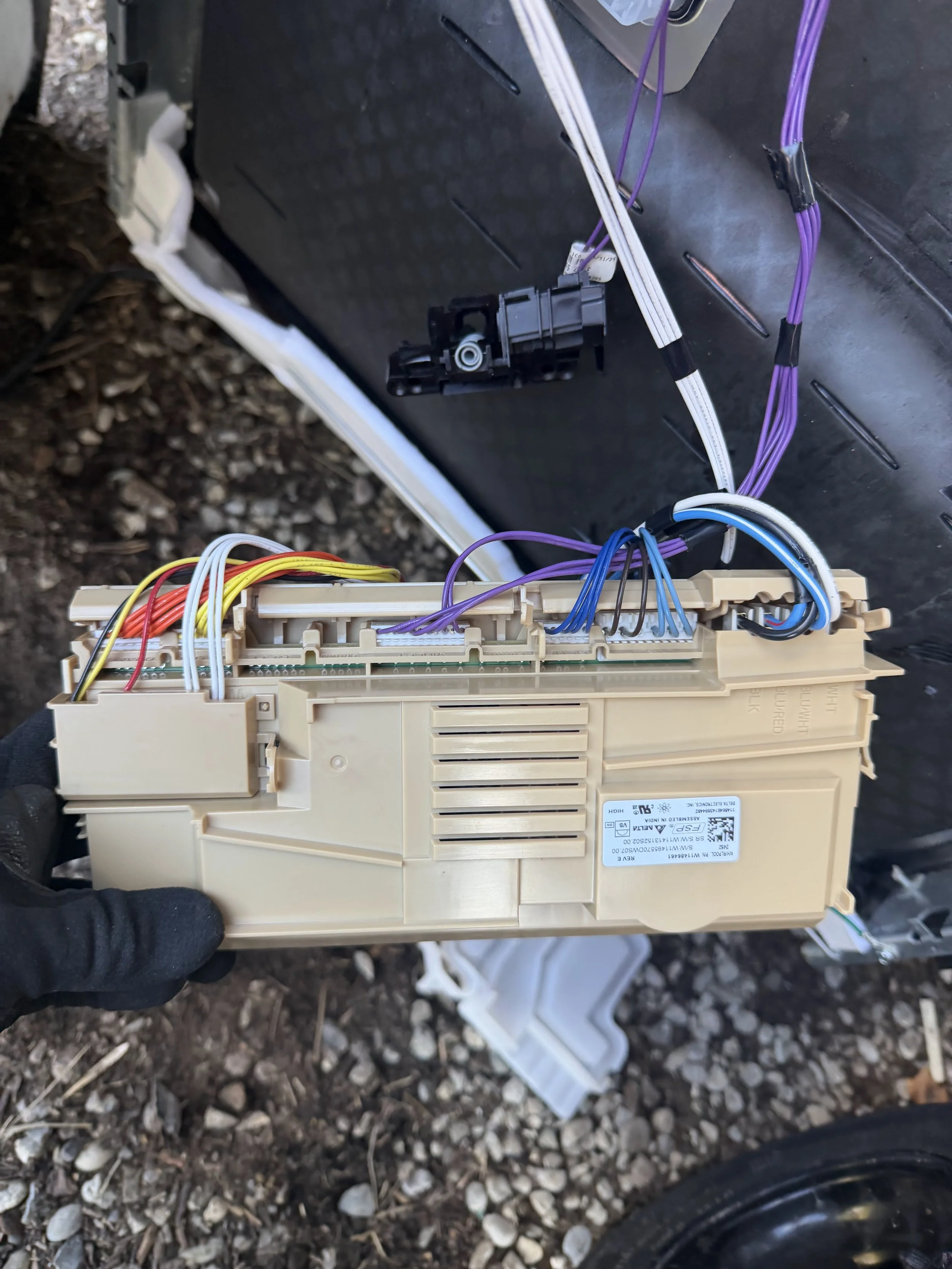 Control board with ribbon wiring during an appliance repair in Spokane Valley by SD Appliance