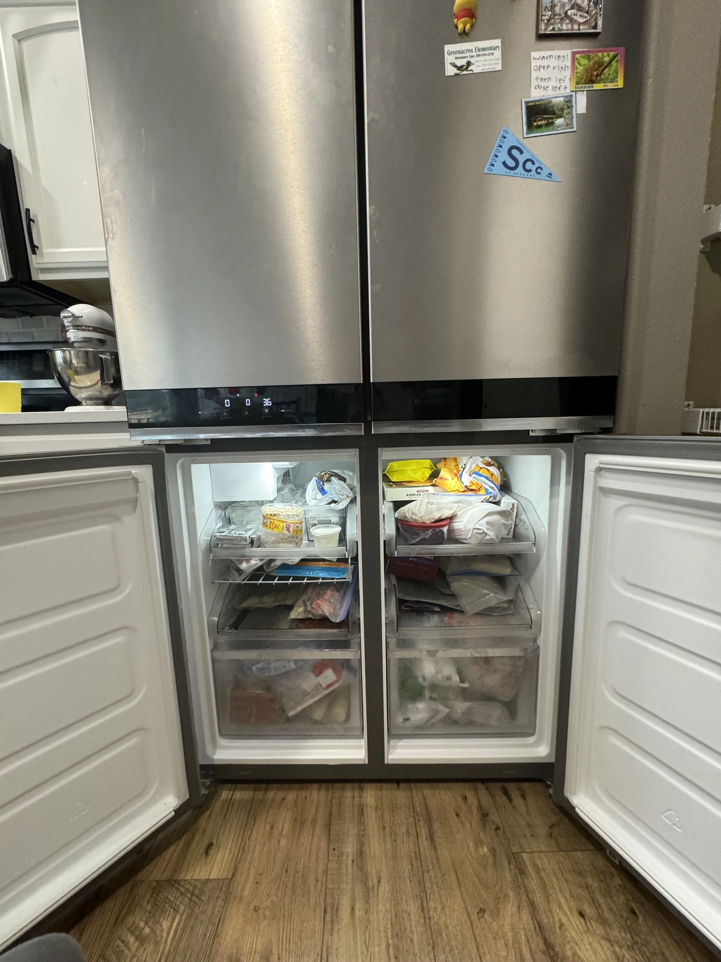 French-door refrigerator, open and stocked