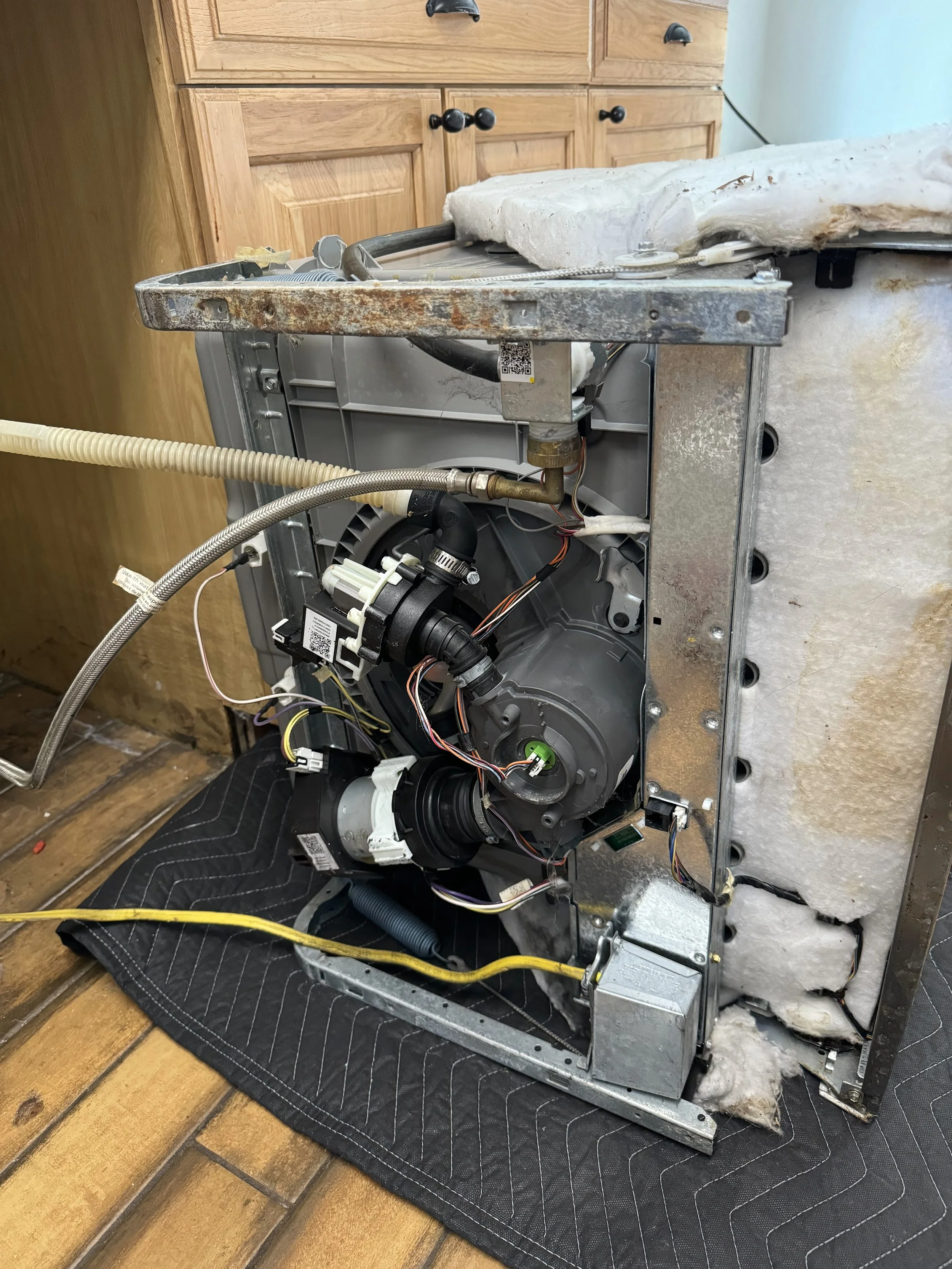 Dryer blower housing and motor during a Spokane dryer repair by SD Appliance