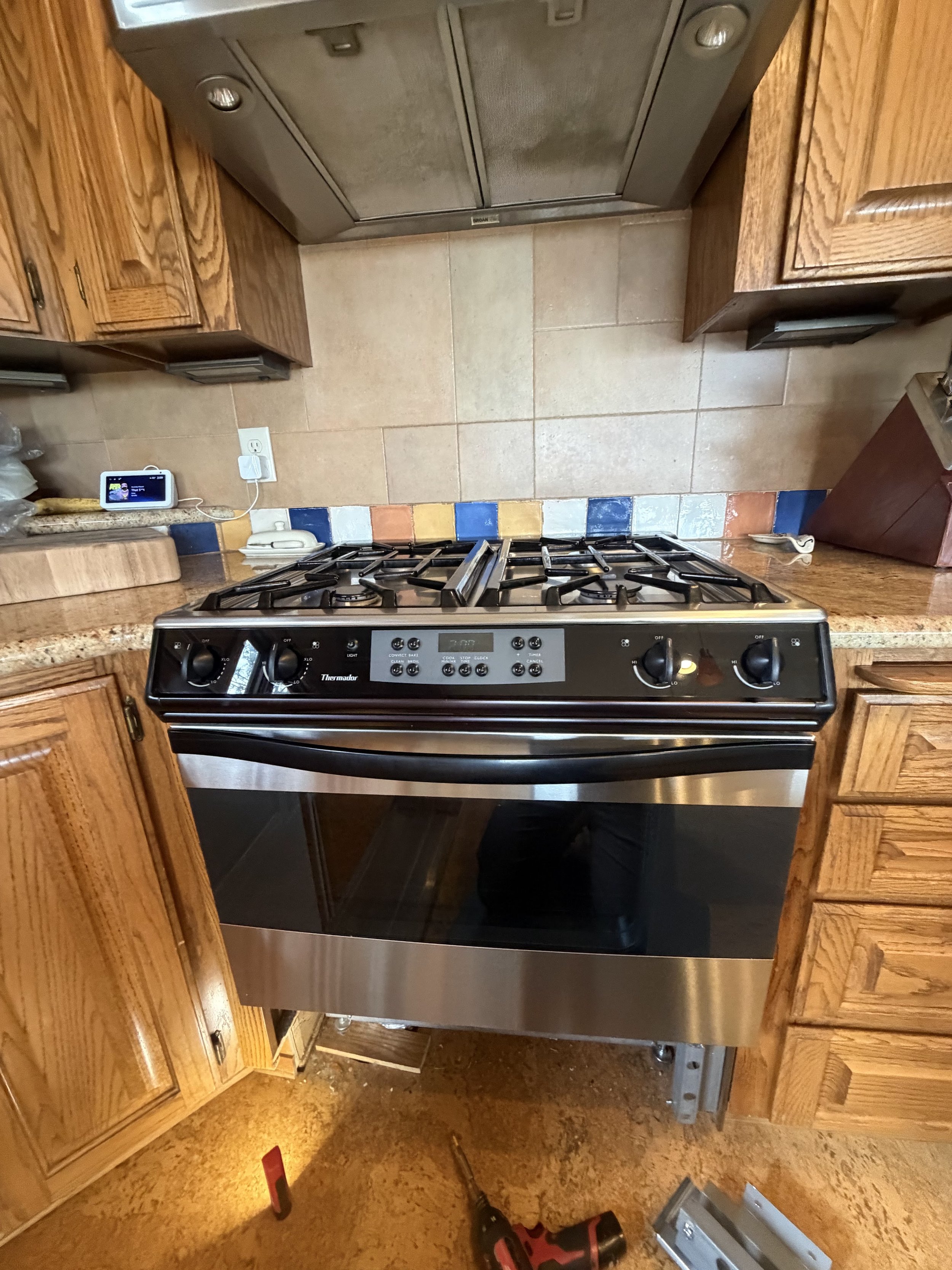 Stainless gas range in a kitchen