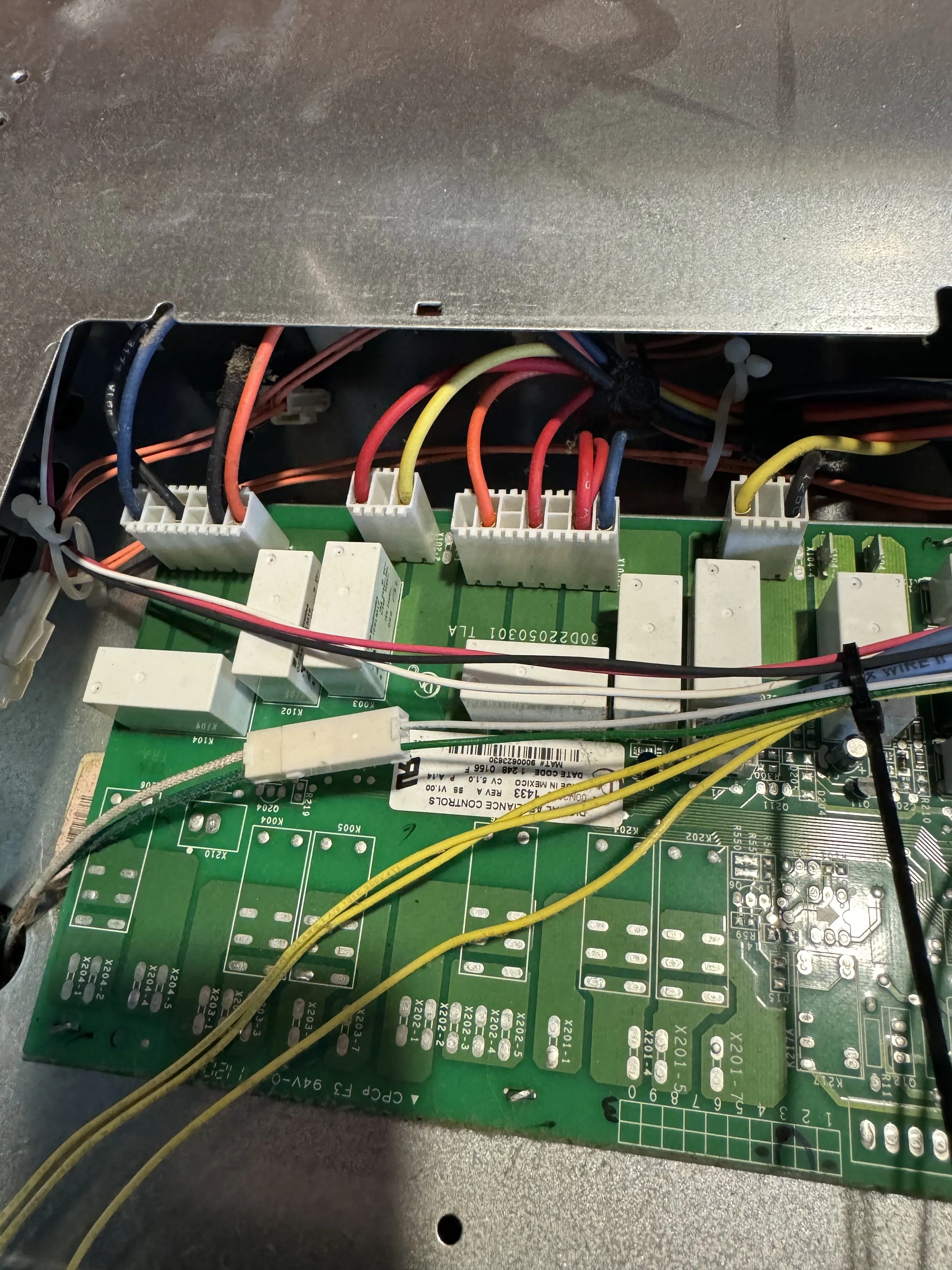Appliance control board with its wiring harness