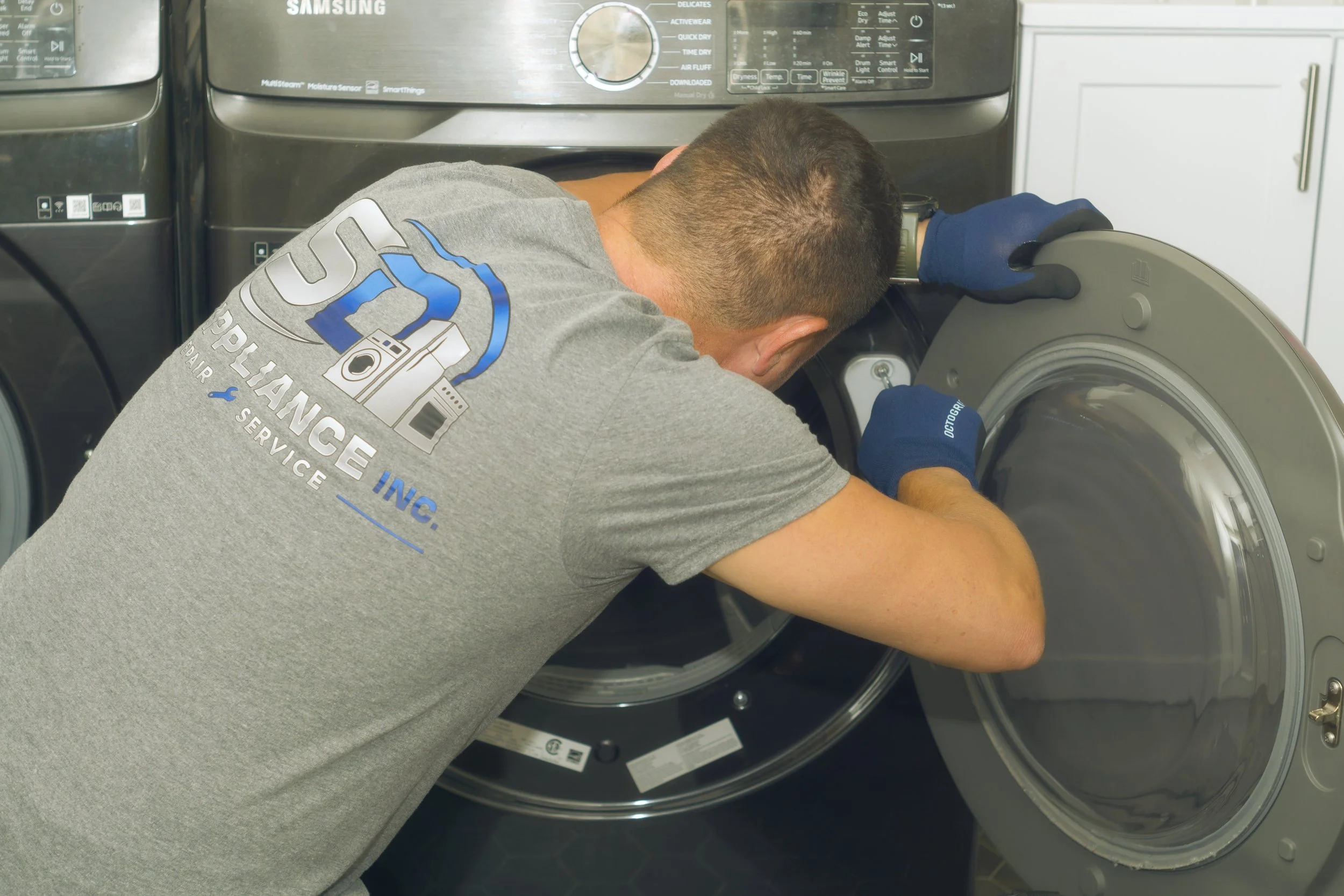 Sergei Dergunov removing a washer panel