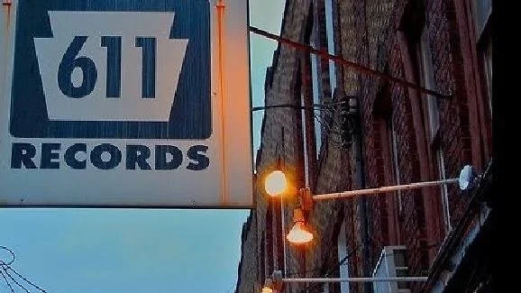 The 611 Records sign on 4th Street at dusk