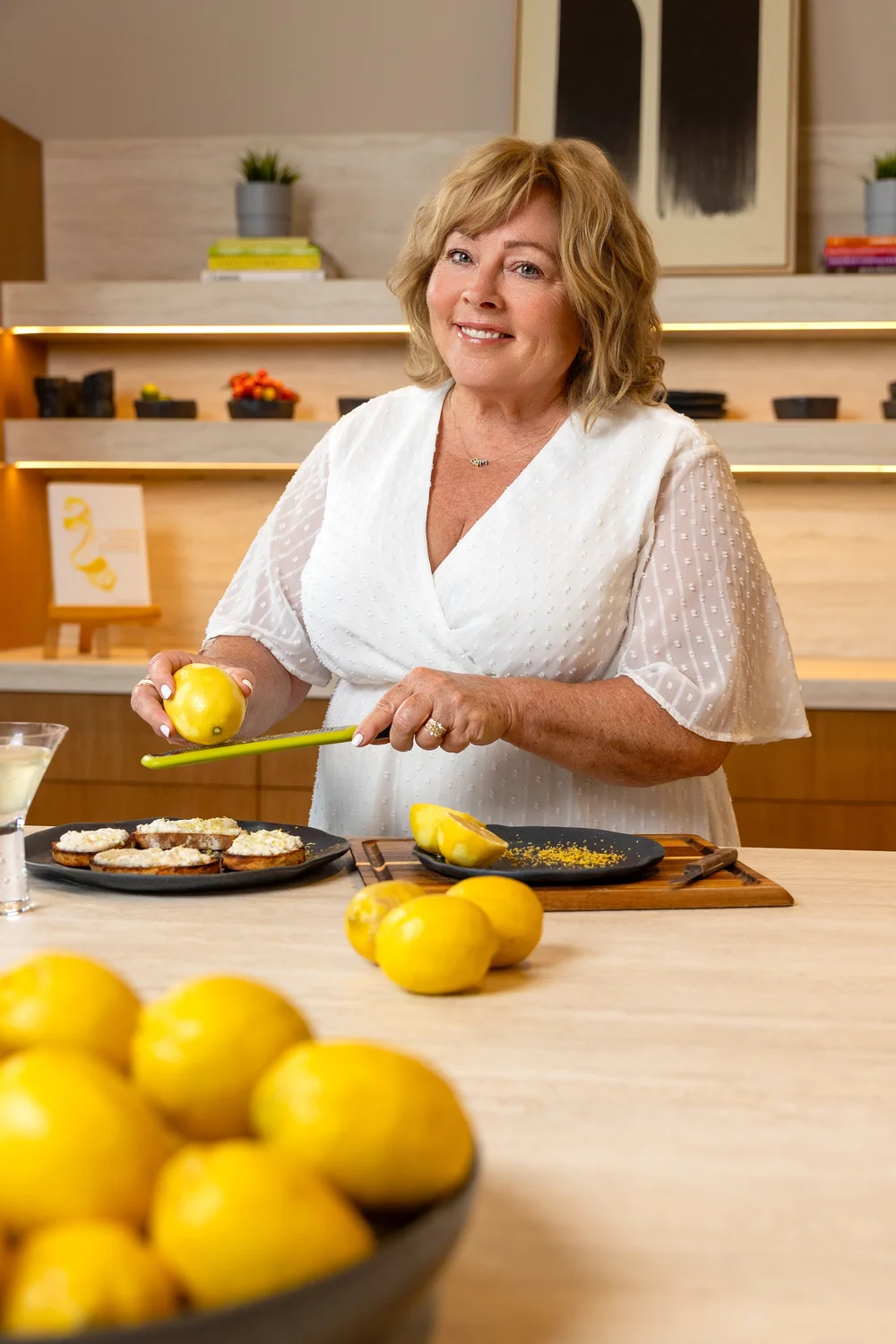 Joanna Palmer zesting a lemon at her kitchen counter