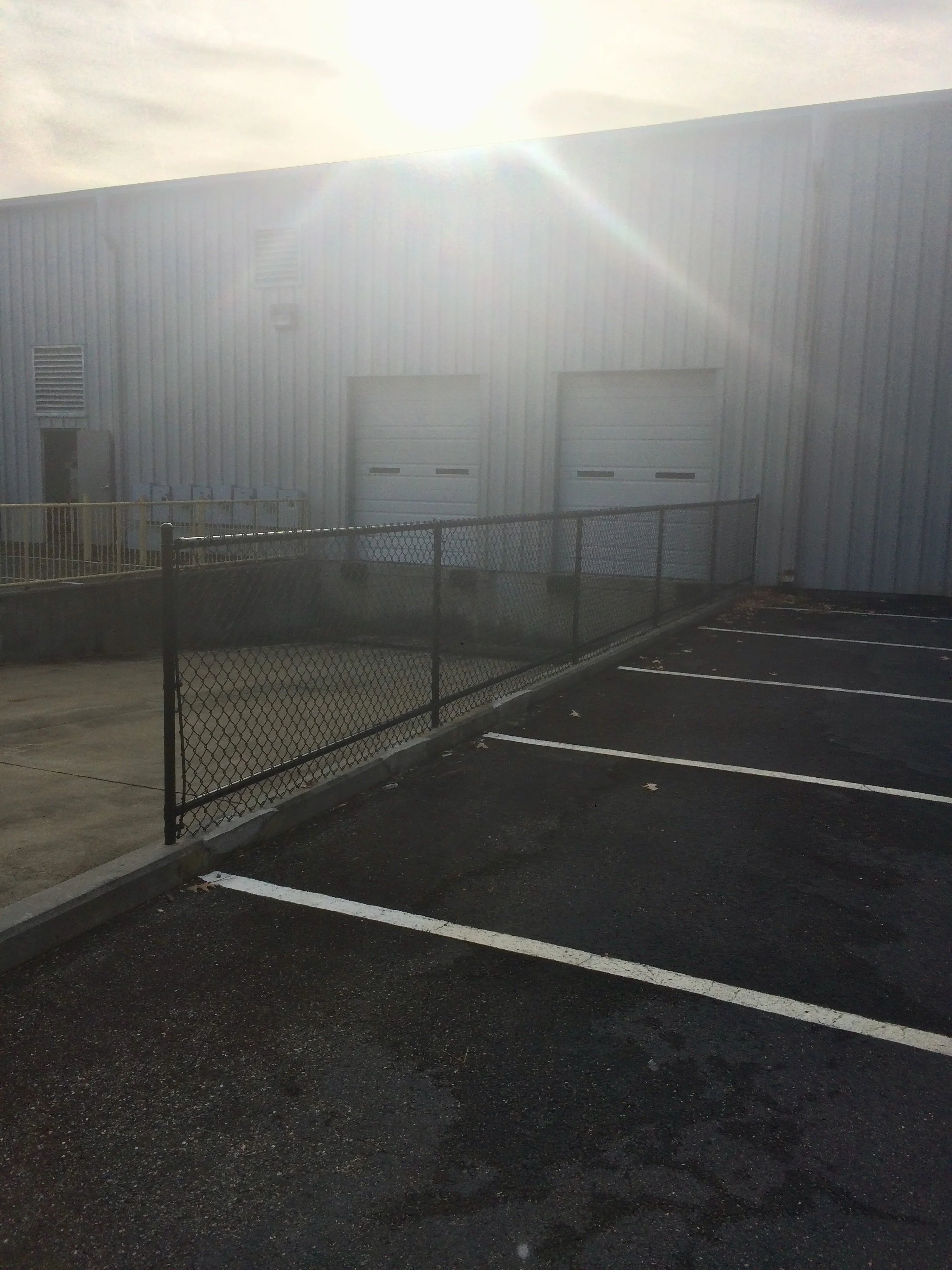 Crusberg Fence team reviewing a commercial job