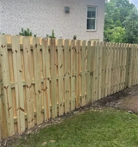 Fence line set back from a stream on a Suffolk, VA lot
