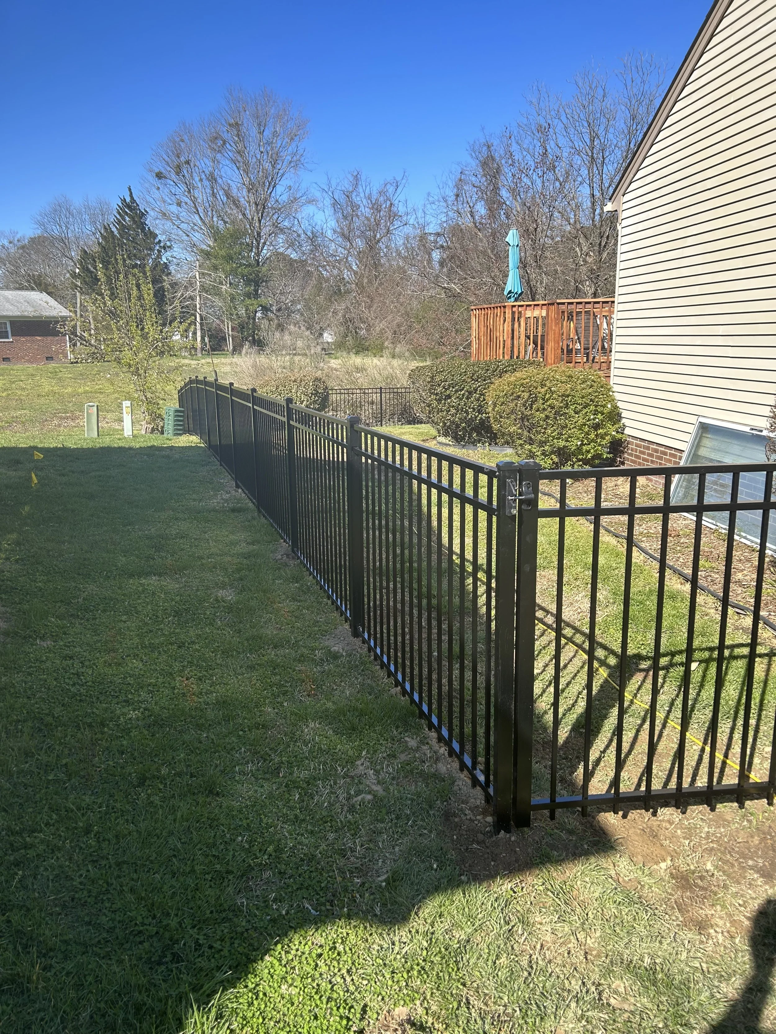 Ornamental fence line installed by Crusberg Fence