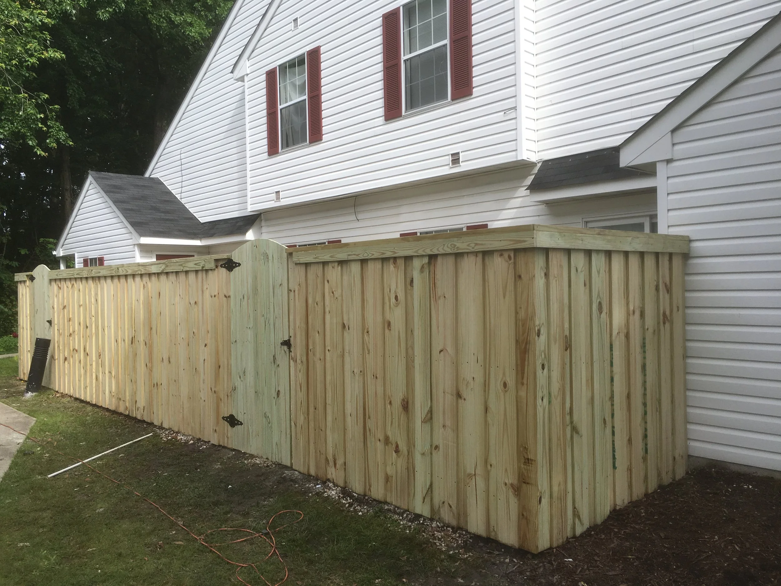 Wood picket fence built by Crusberg Fence