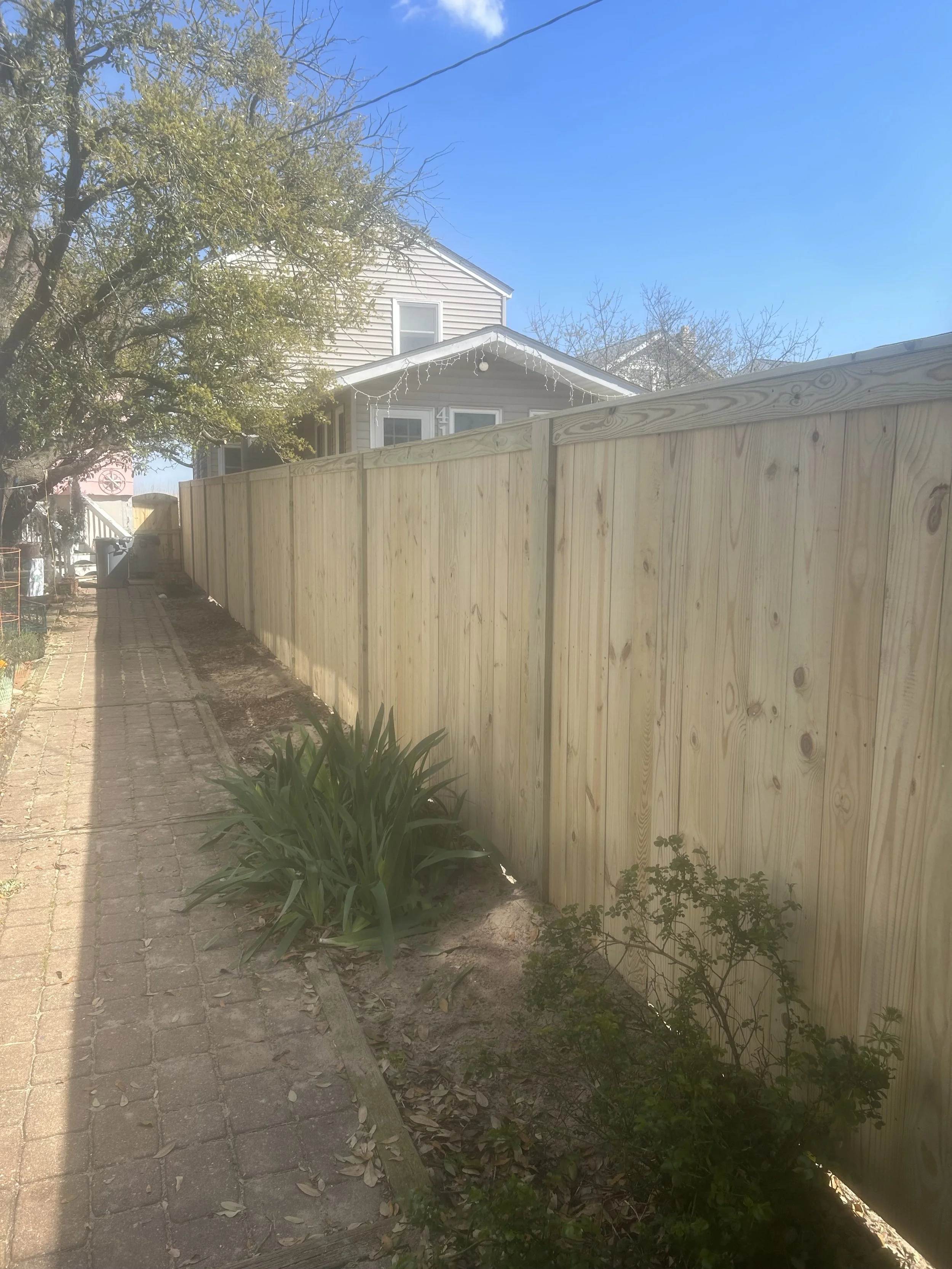 Pressure washing a wood fence, Crusberg Fence