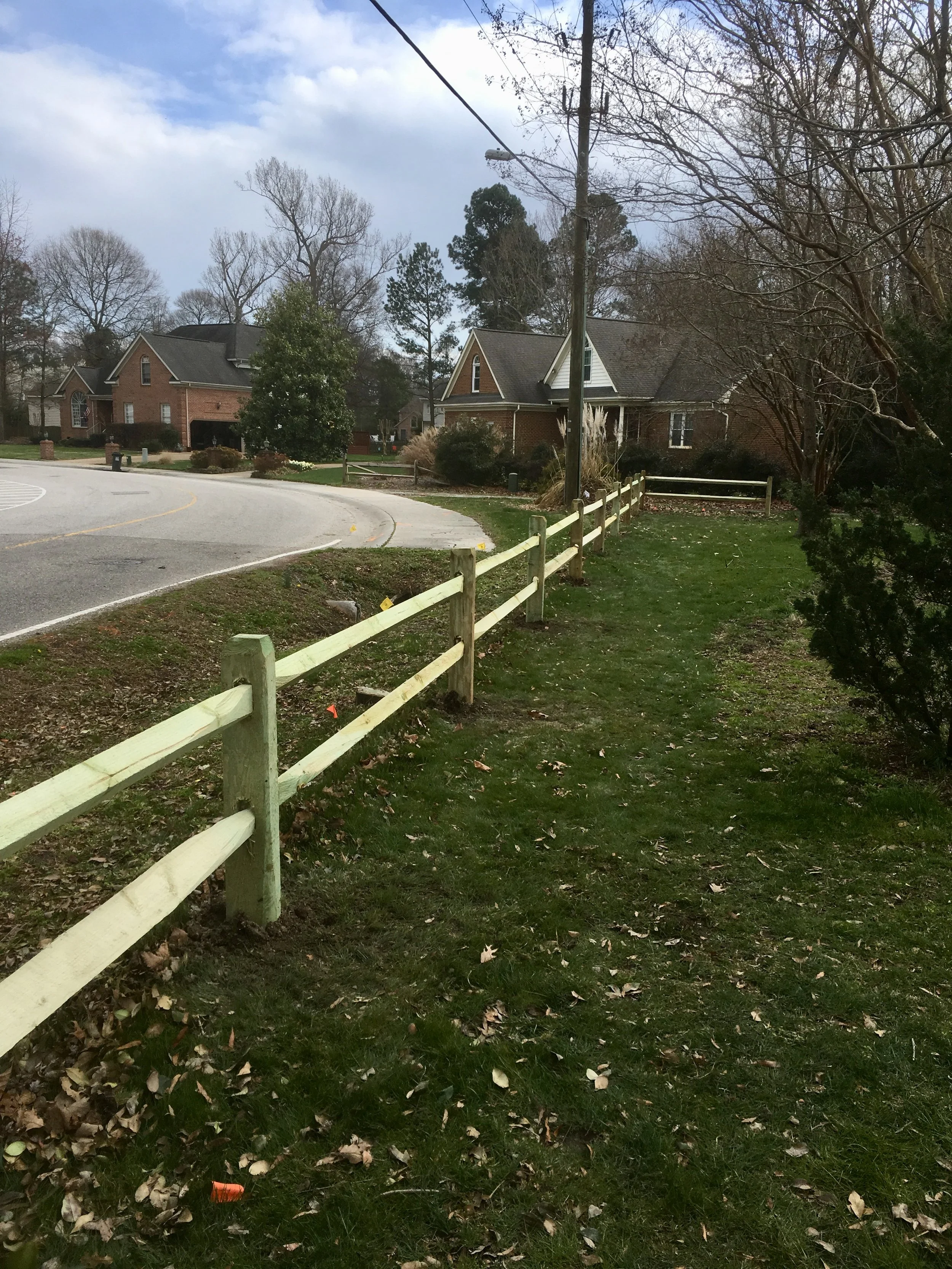 Crusberg Fence crew boring a post hole two feet deep