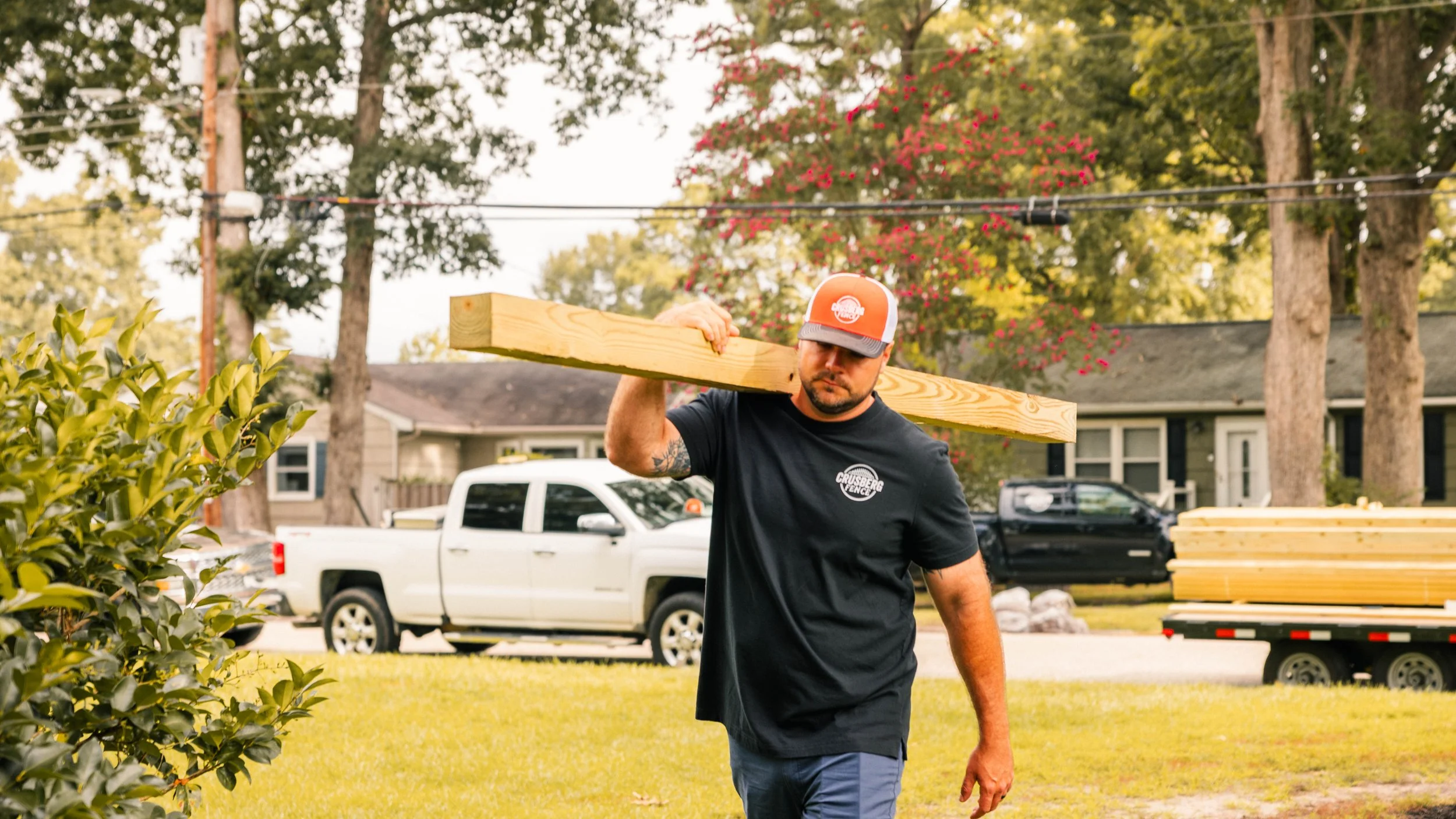 Fence post set two feet deep in concrete on a Gloucester County lot