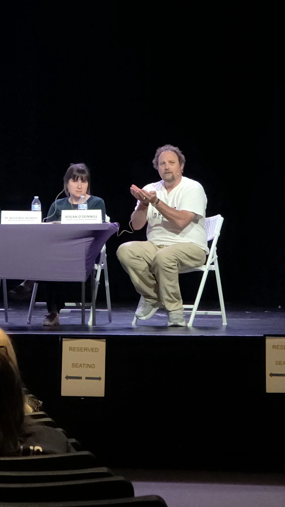 Rogan O'Donnell speaking on a panel after an InhuMAINE screening