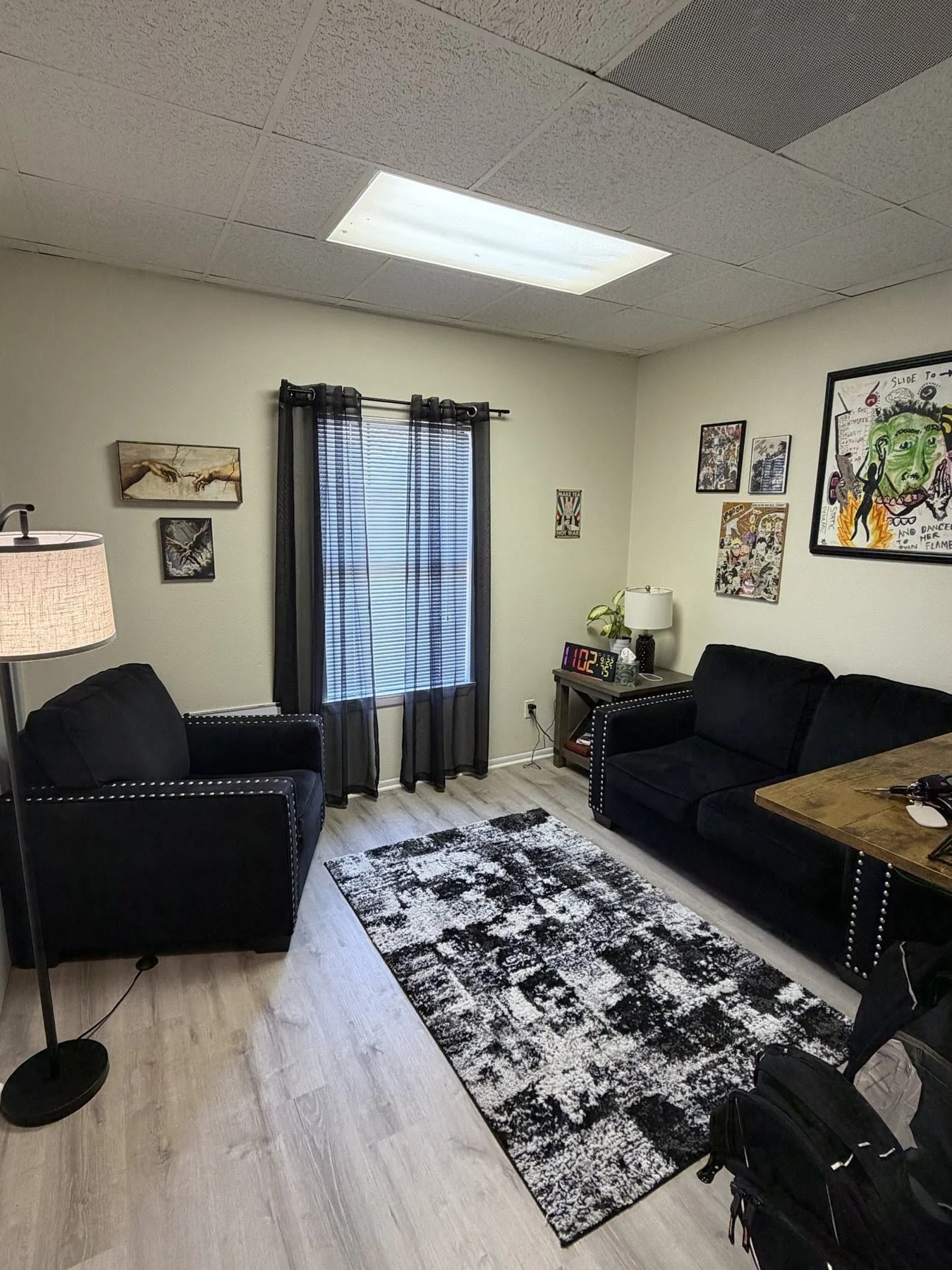 PTP counseling room with an armchair, loveseat and natural light